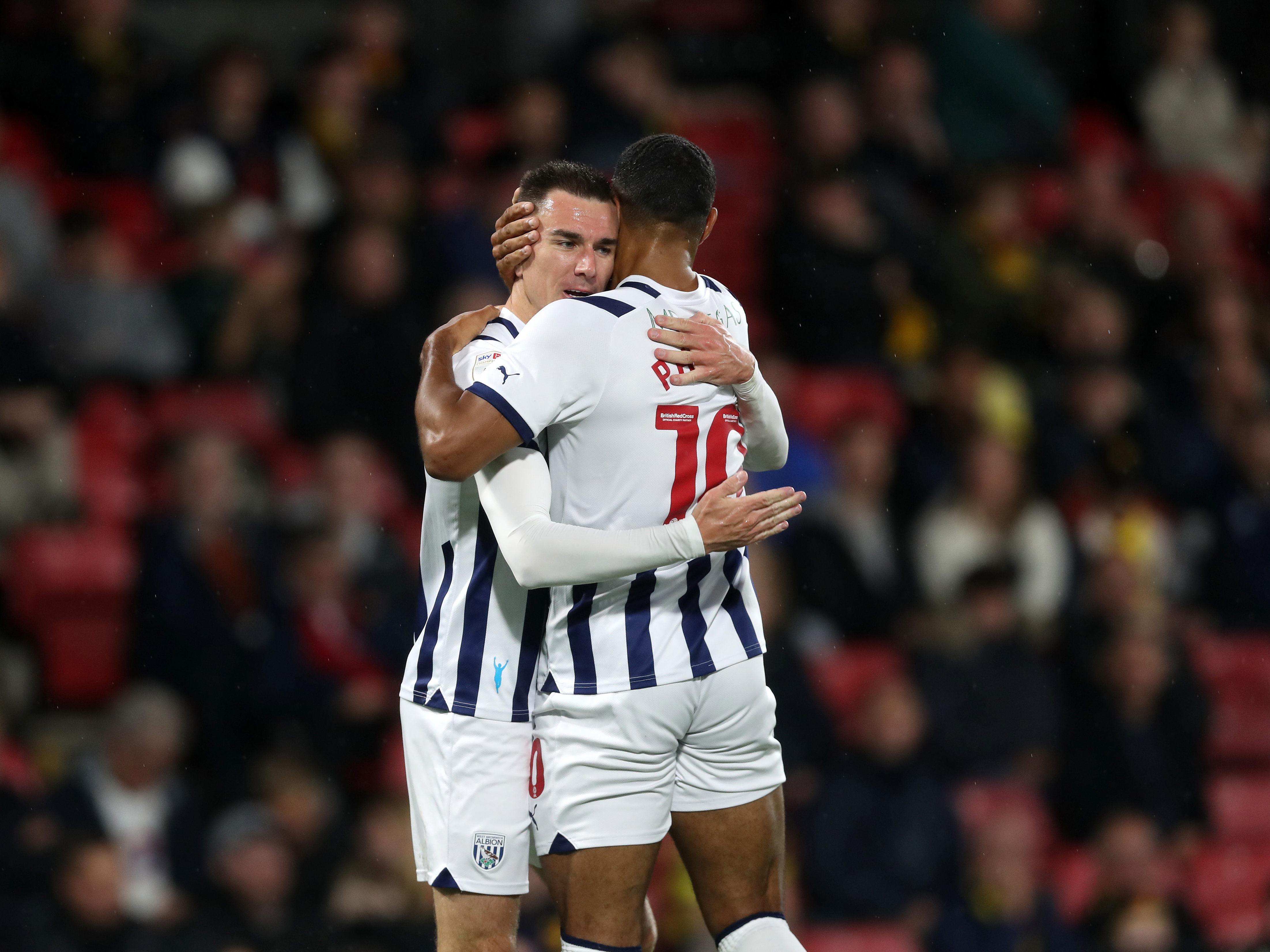 An image of Jed Wallace and Matt Phillips embracing