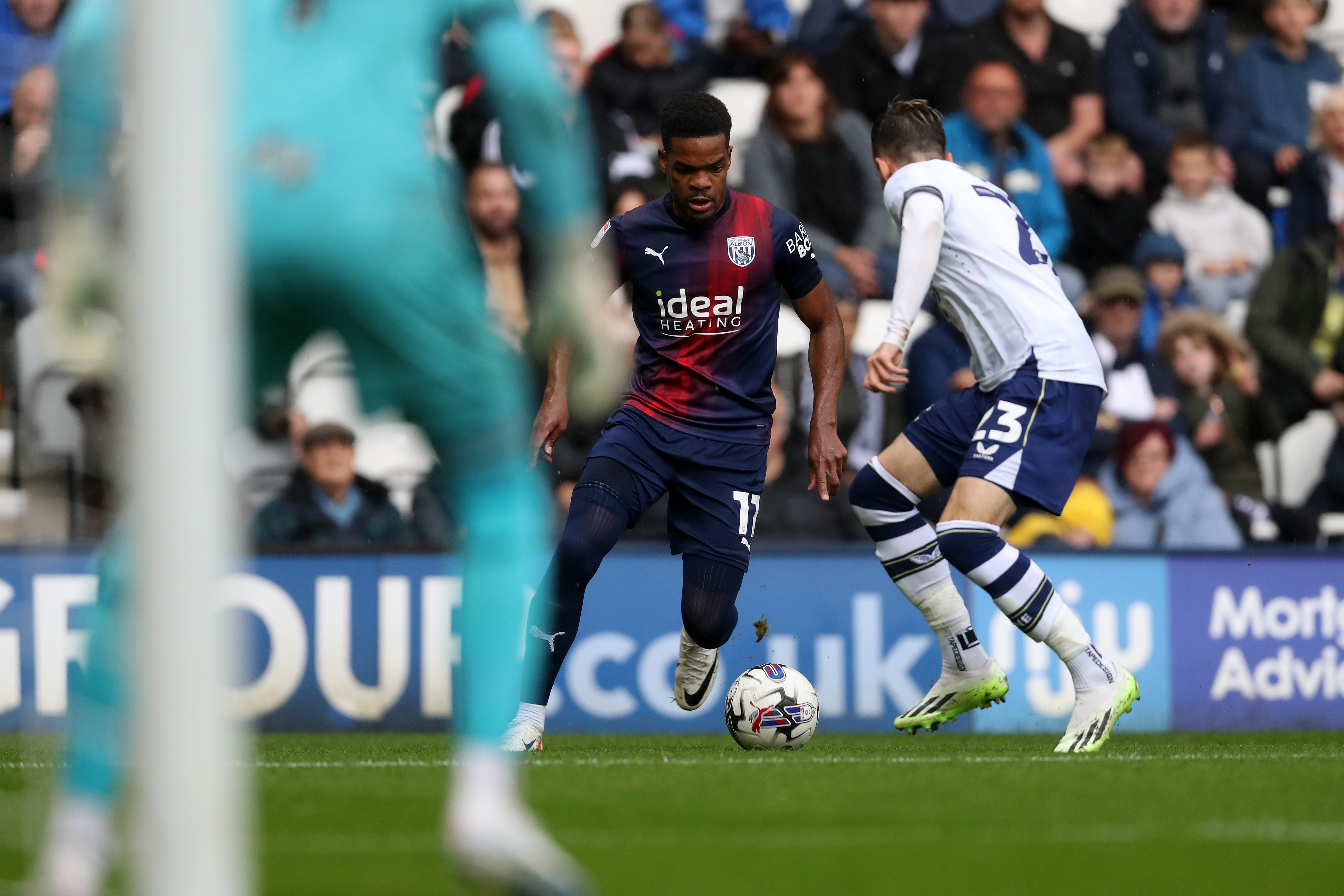 Grady Diangana takes on a Preston defender 