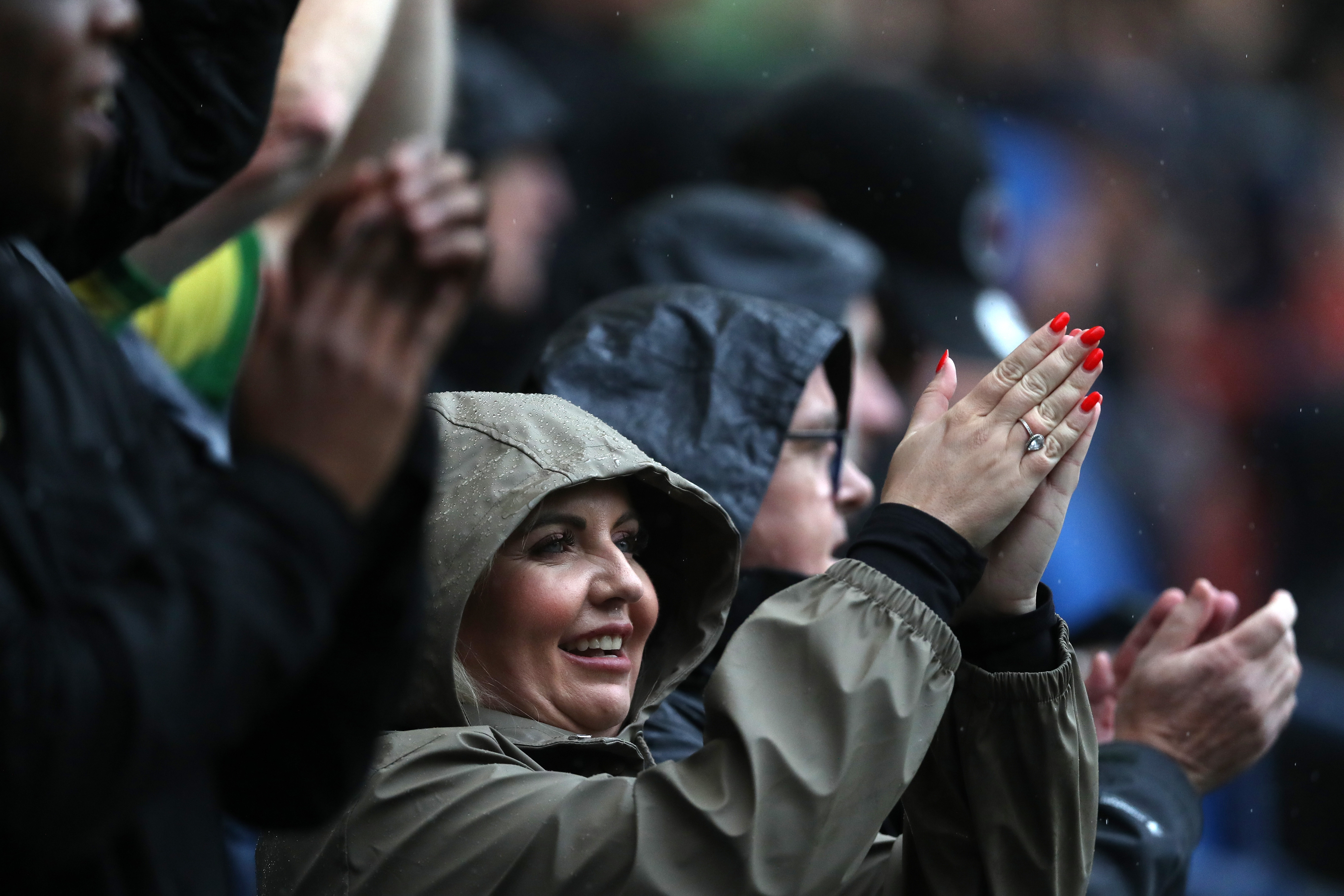 A female Albion fan clapping