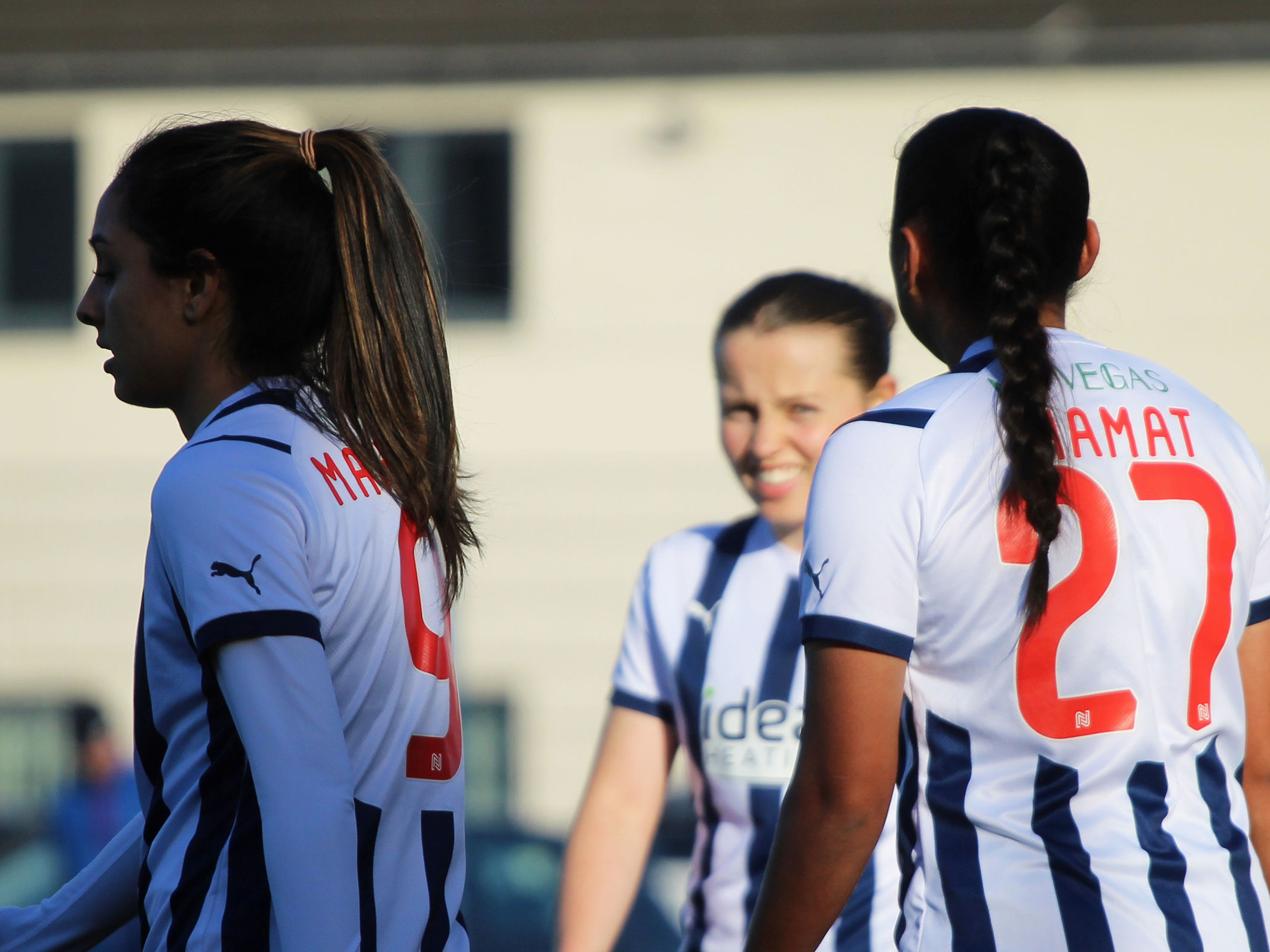 Albion Women players Jhamat, Loydon and Mahmood celebrate a goal against Leafield