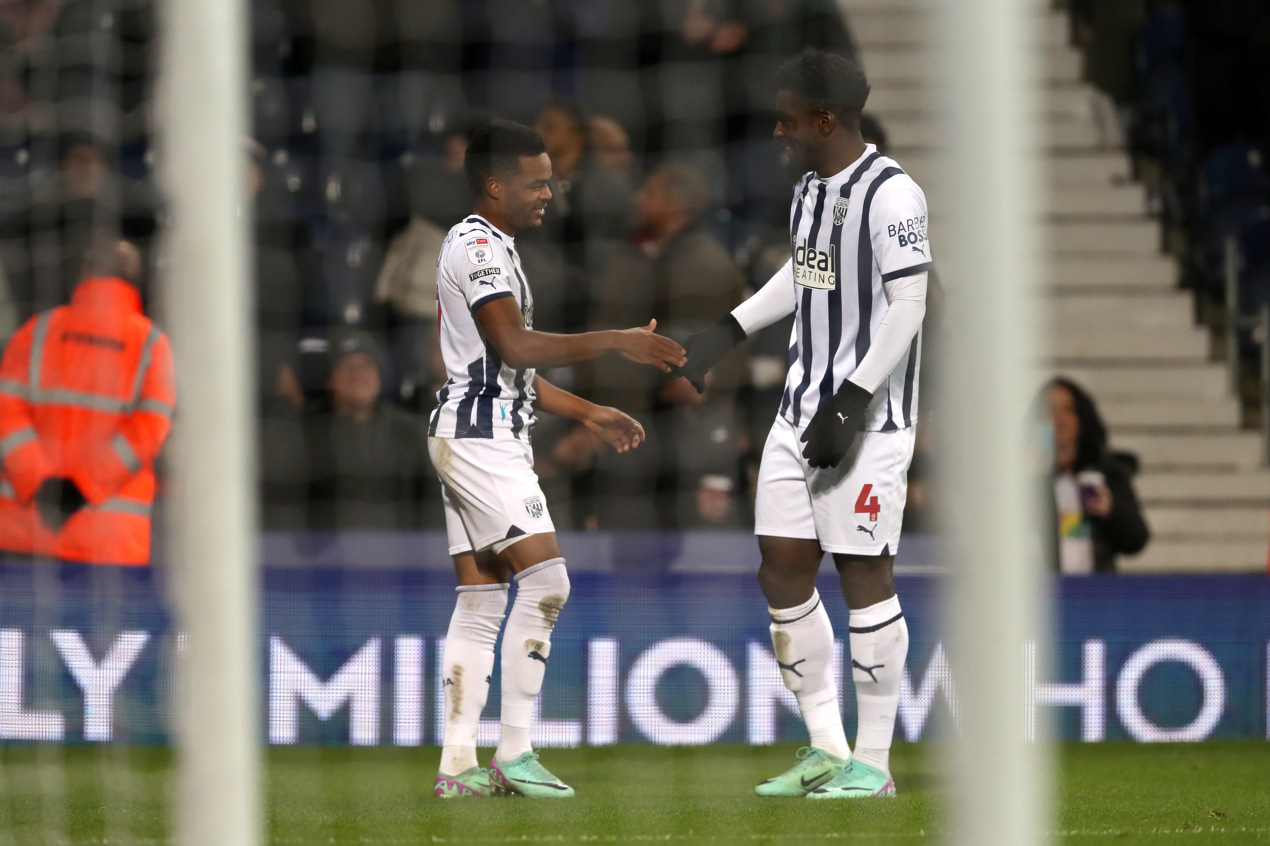 Grady Diangana celebrates scoring against Ipswich with Cedric Kipre