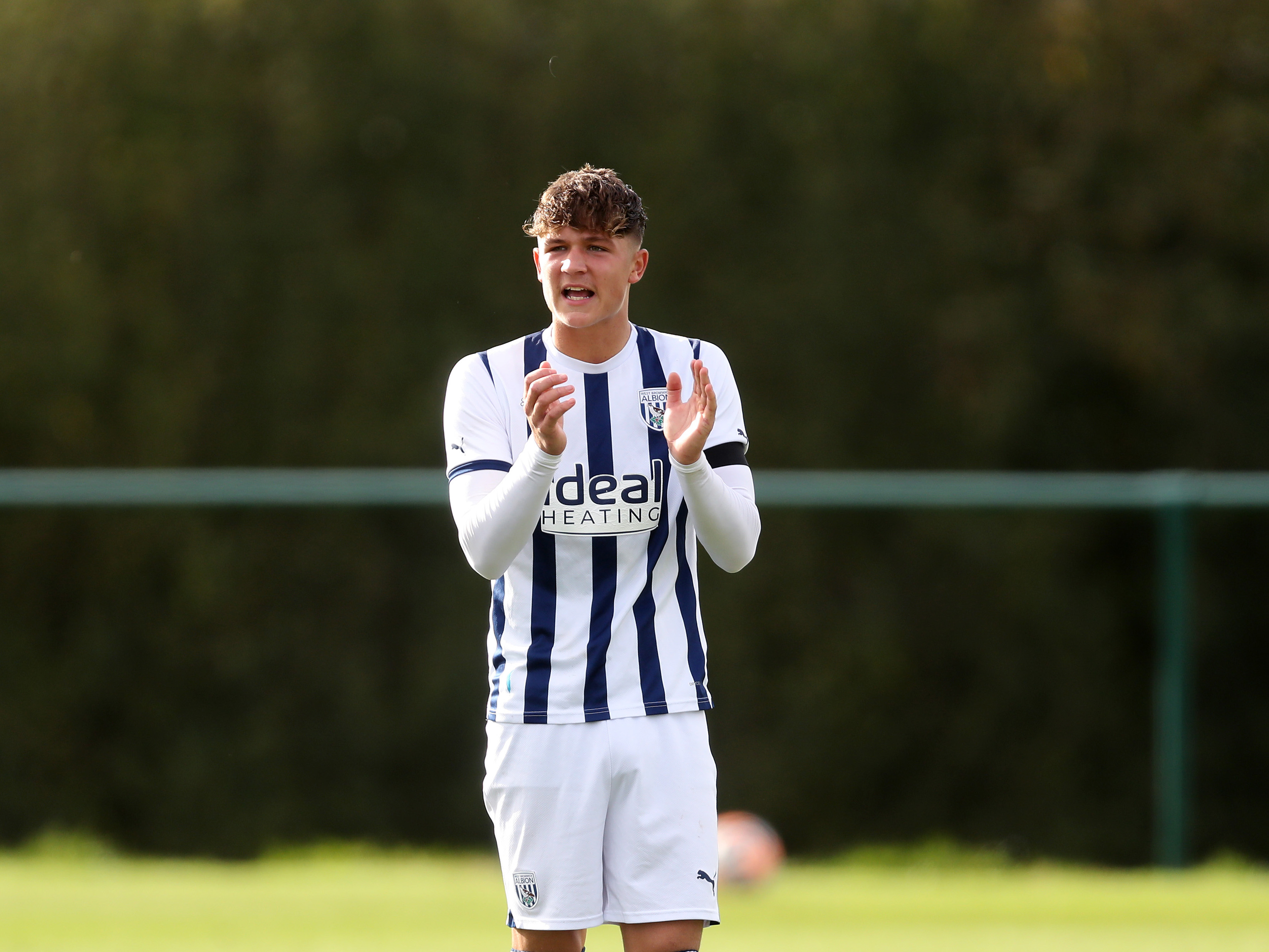 A photo of Albion U18 Cole Deeming encouraging his team-mates during their game v West Ham at the club's Walsall training ground