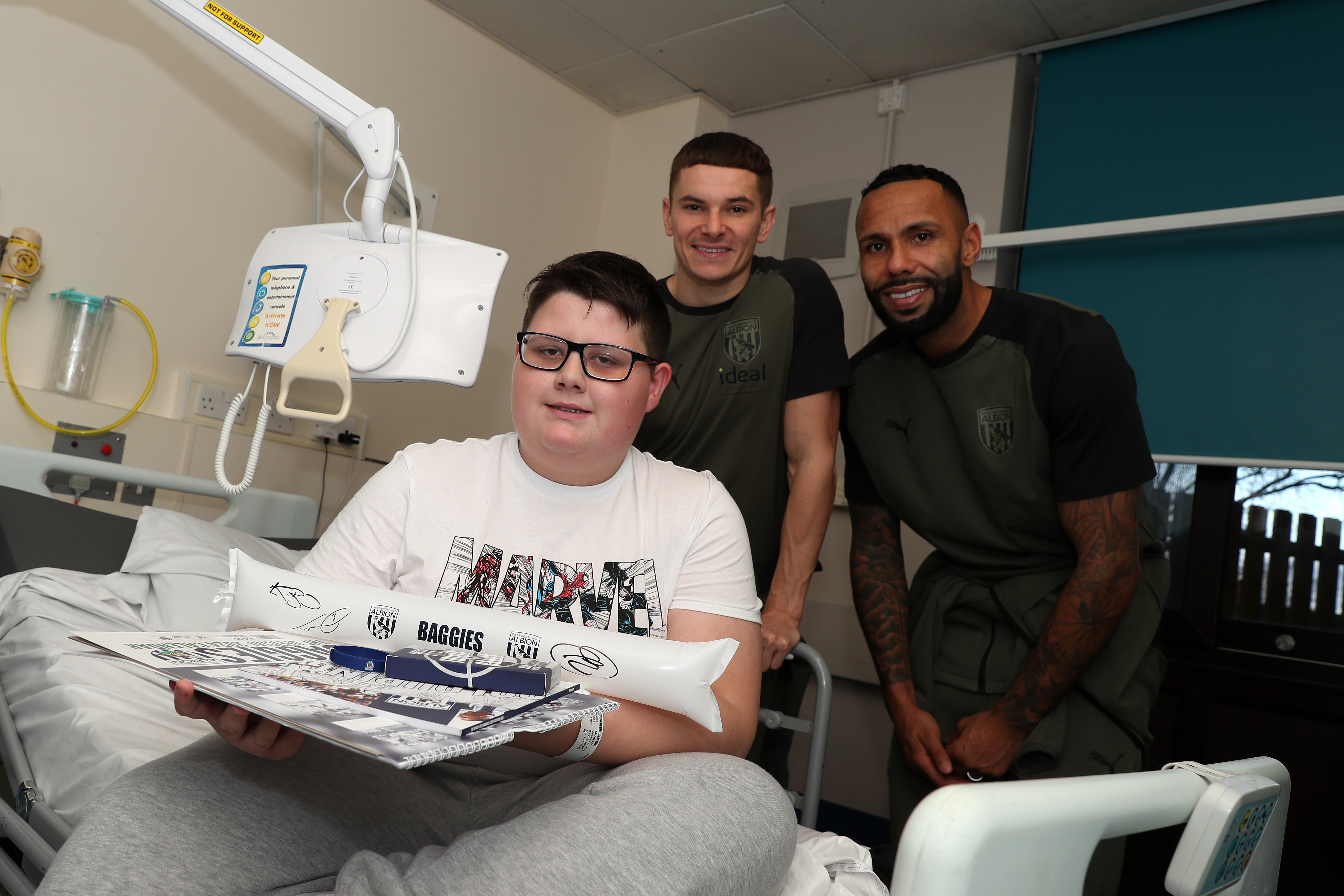 Conor Townsend and Kyle Bartley pose for a photo with patients at Sandwell General Hospital