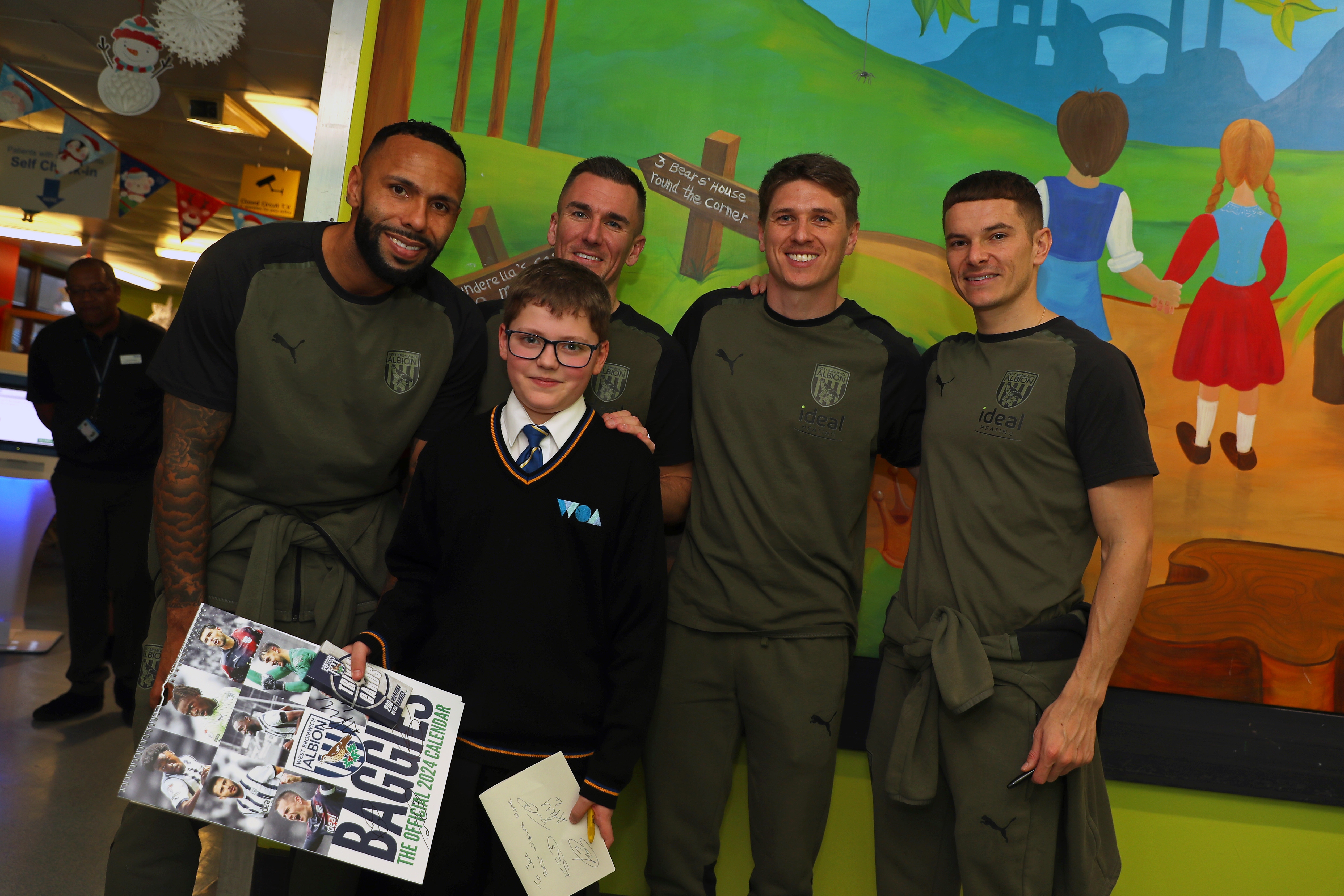 Kyle Bartley, Conor Townsend, Adam Reach and Jed Wallace pose for a photo with patients at Sandwell General Hospital