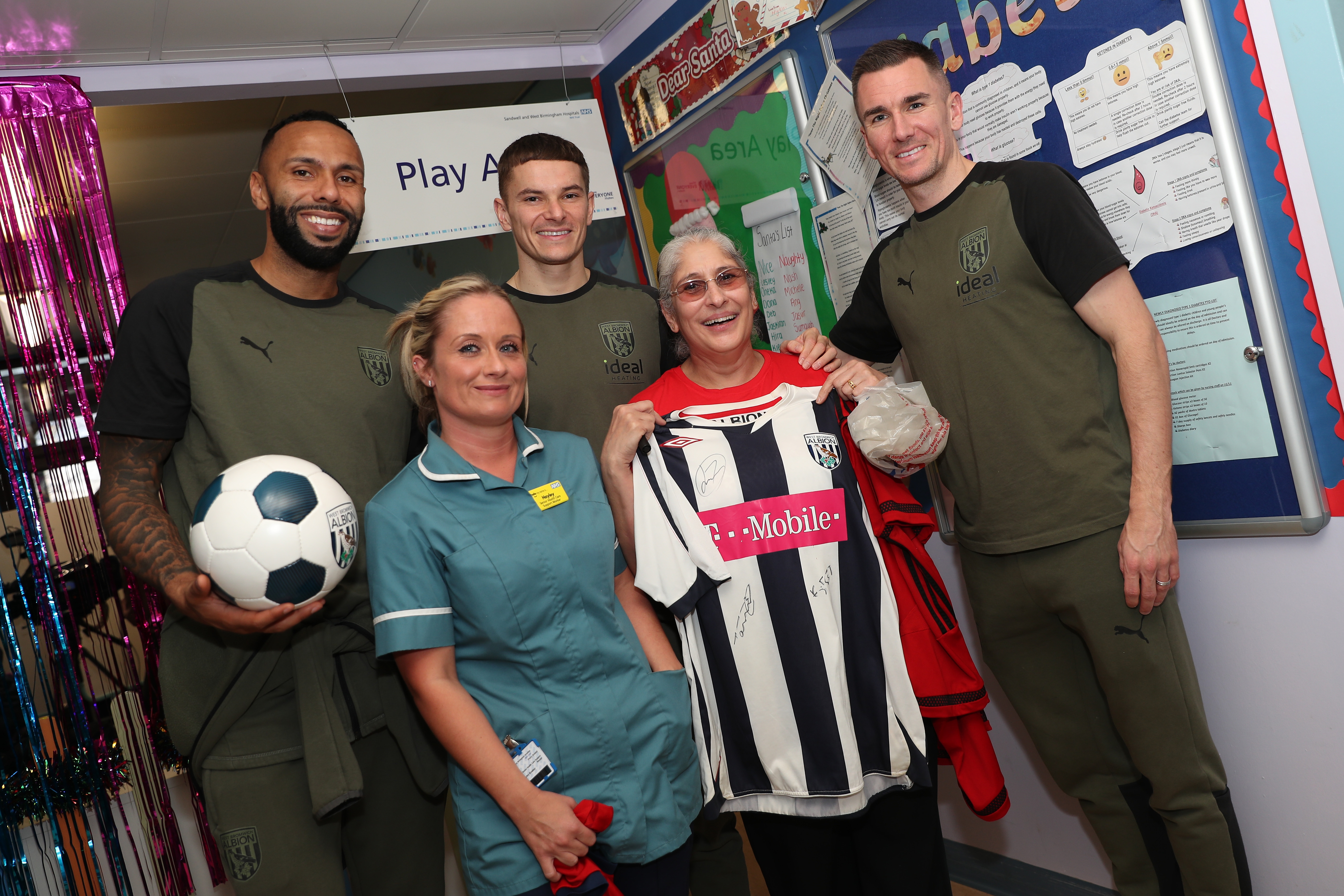 Kyle Bartley, Conor Townsend and Jed Wallace pose for a photo with NHS workers at Sandwell General Hospital