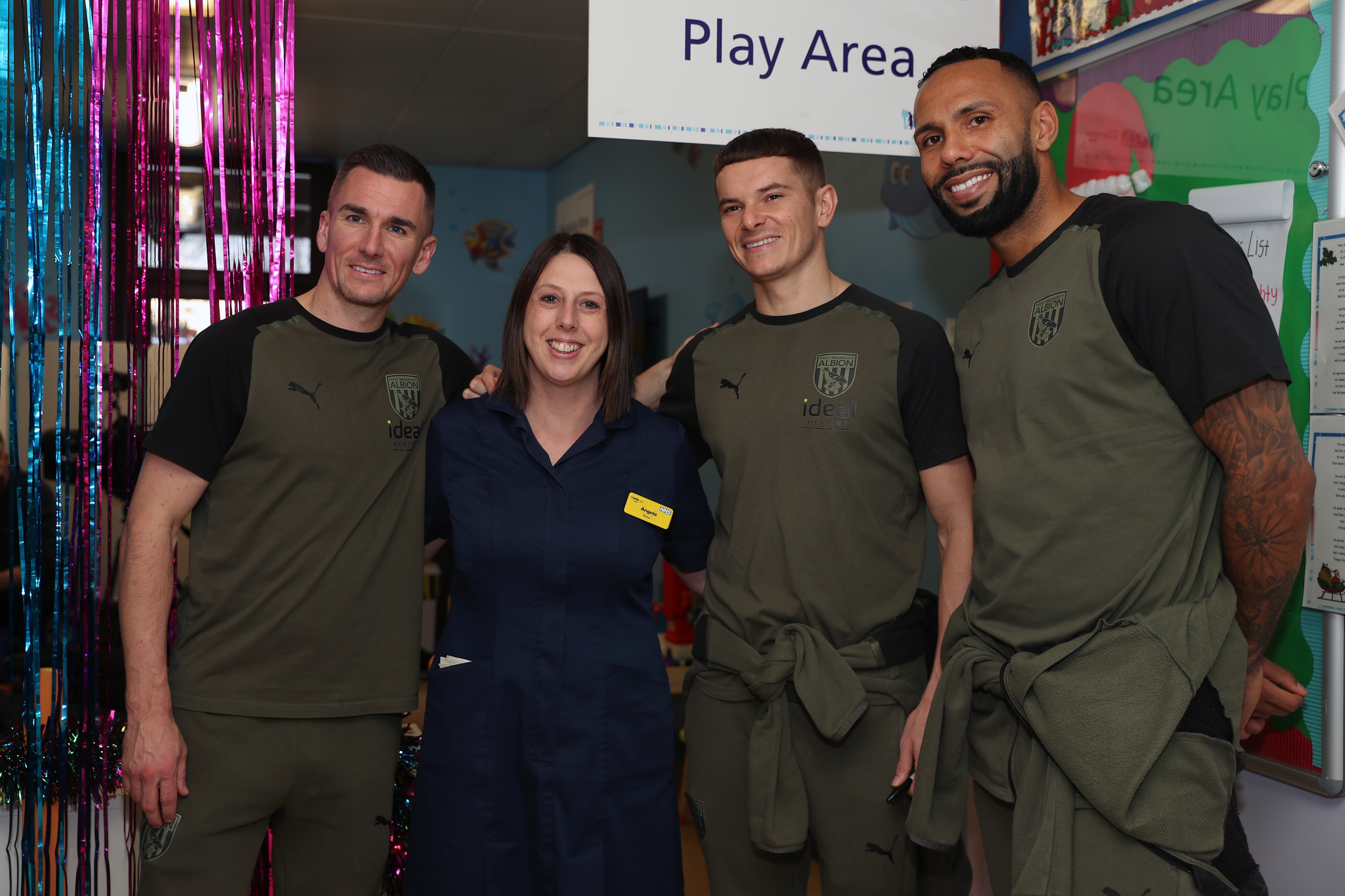 Kyle Bartley, Conor Townsend and Jed Wallace pose for a photo with NHS workers at Sandwell General Hospital