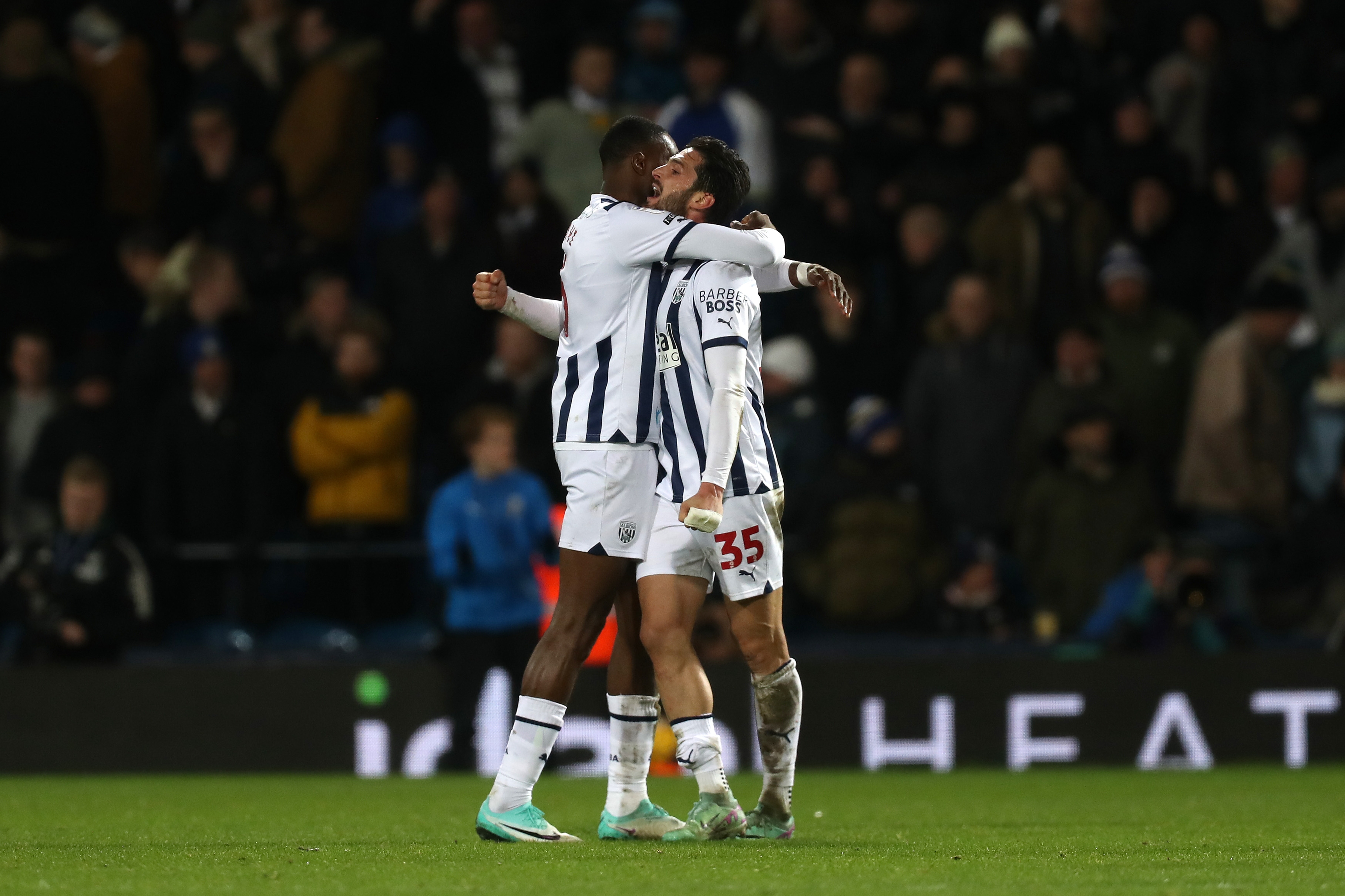 Semi Ajayi and Okay Yokuslu share an embrace at full-time against Leeds 