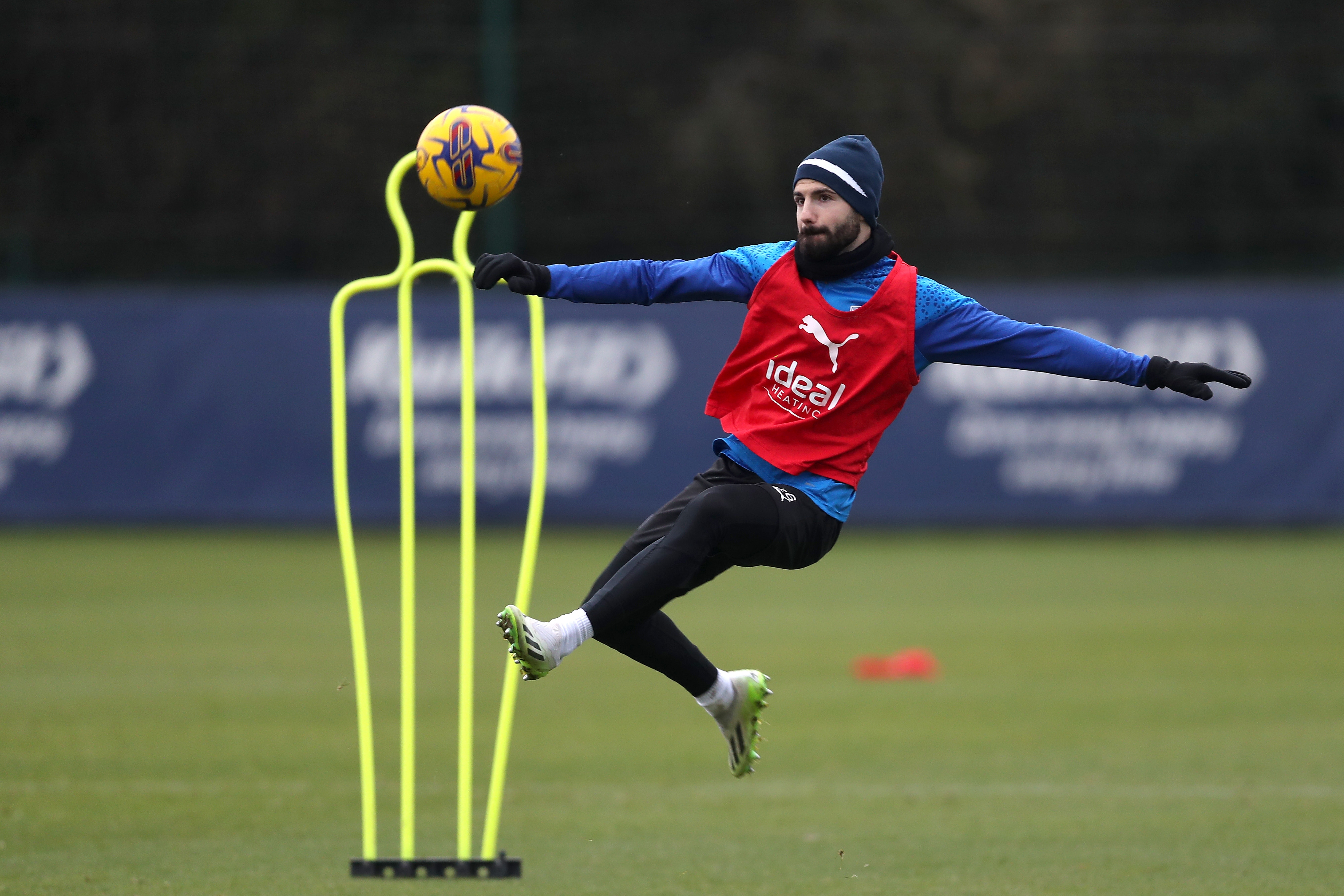 Pipa prepares to acrobatically kick the ball in training 