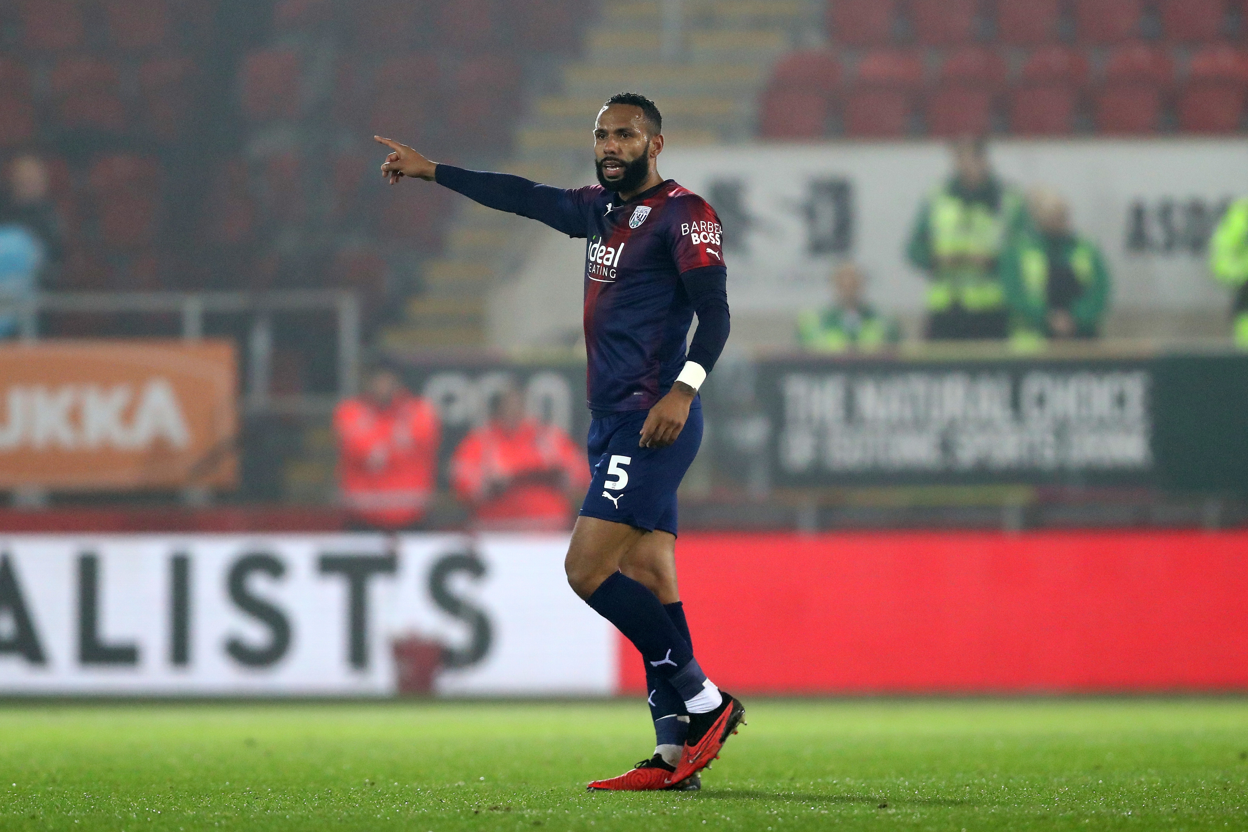 Kyle Bartley pointing to his right against Rotherham