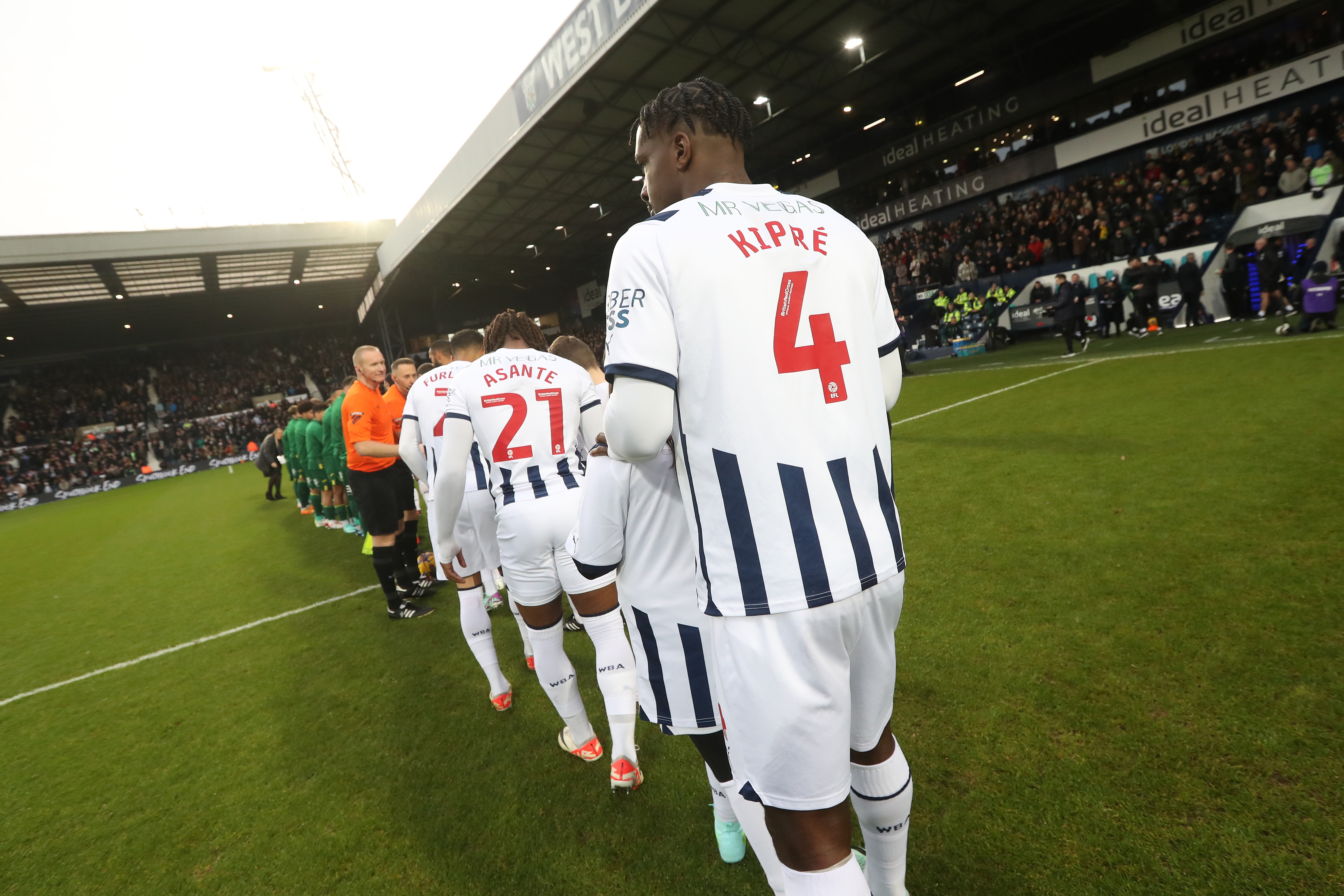 Cedric Kipre with his back to the camera lining up before taking on Norwich