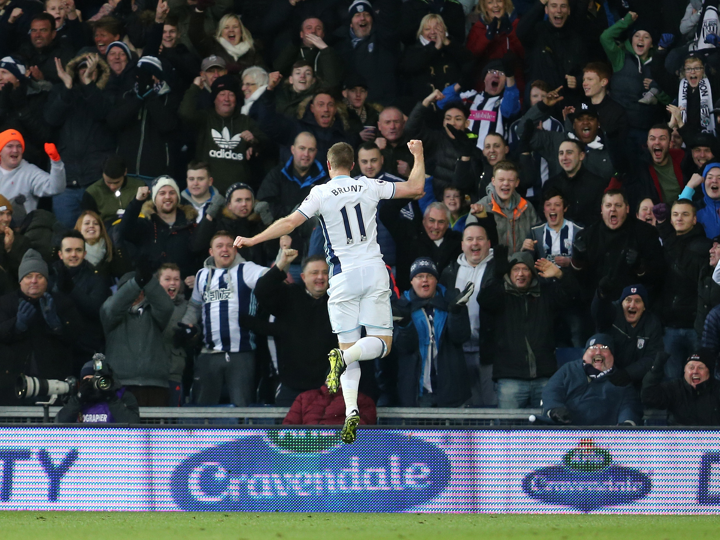 Chris Brunt celebrates scoring a goal in front of the Brummie Road End 