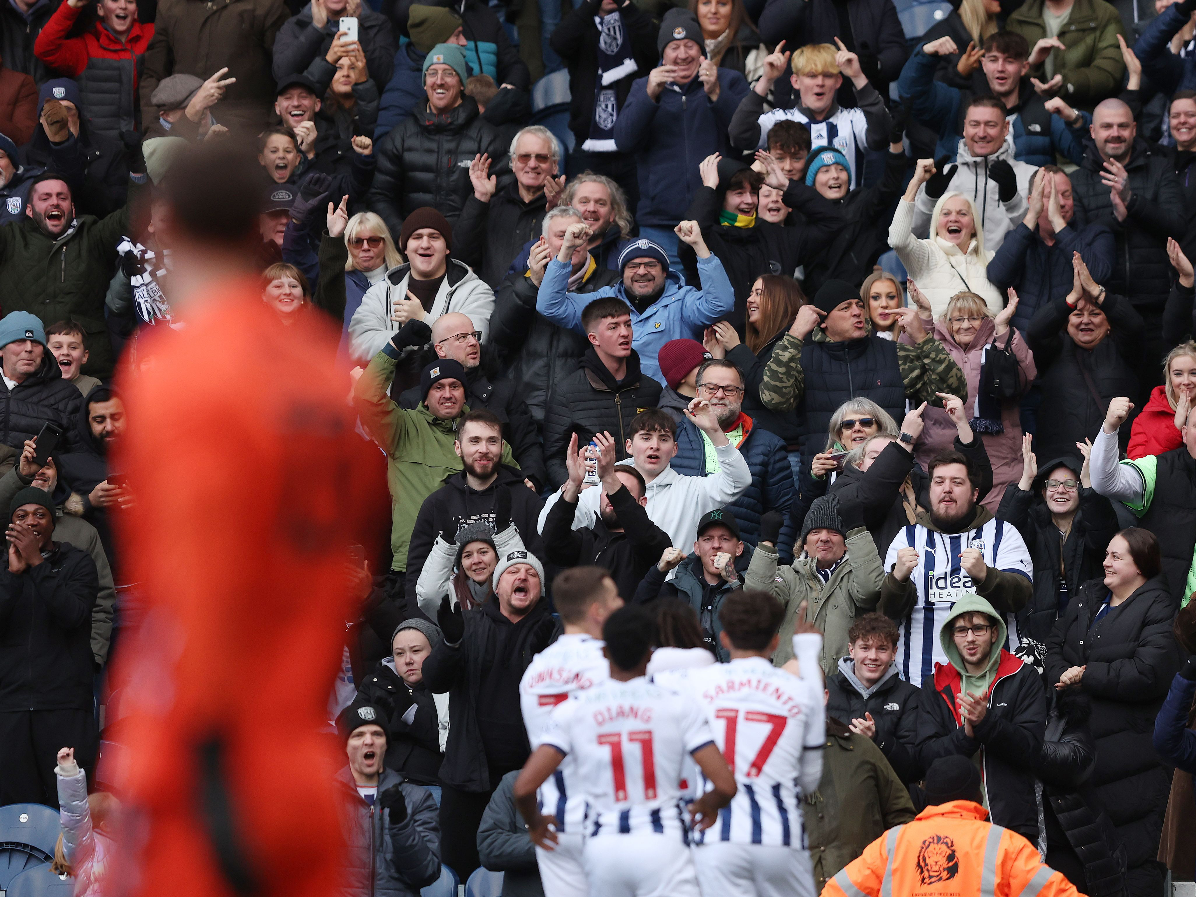 An image of Albion fans celebrating Thomas-Asante's goal against Stoke