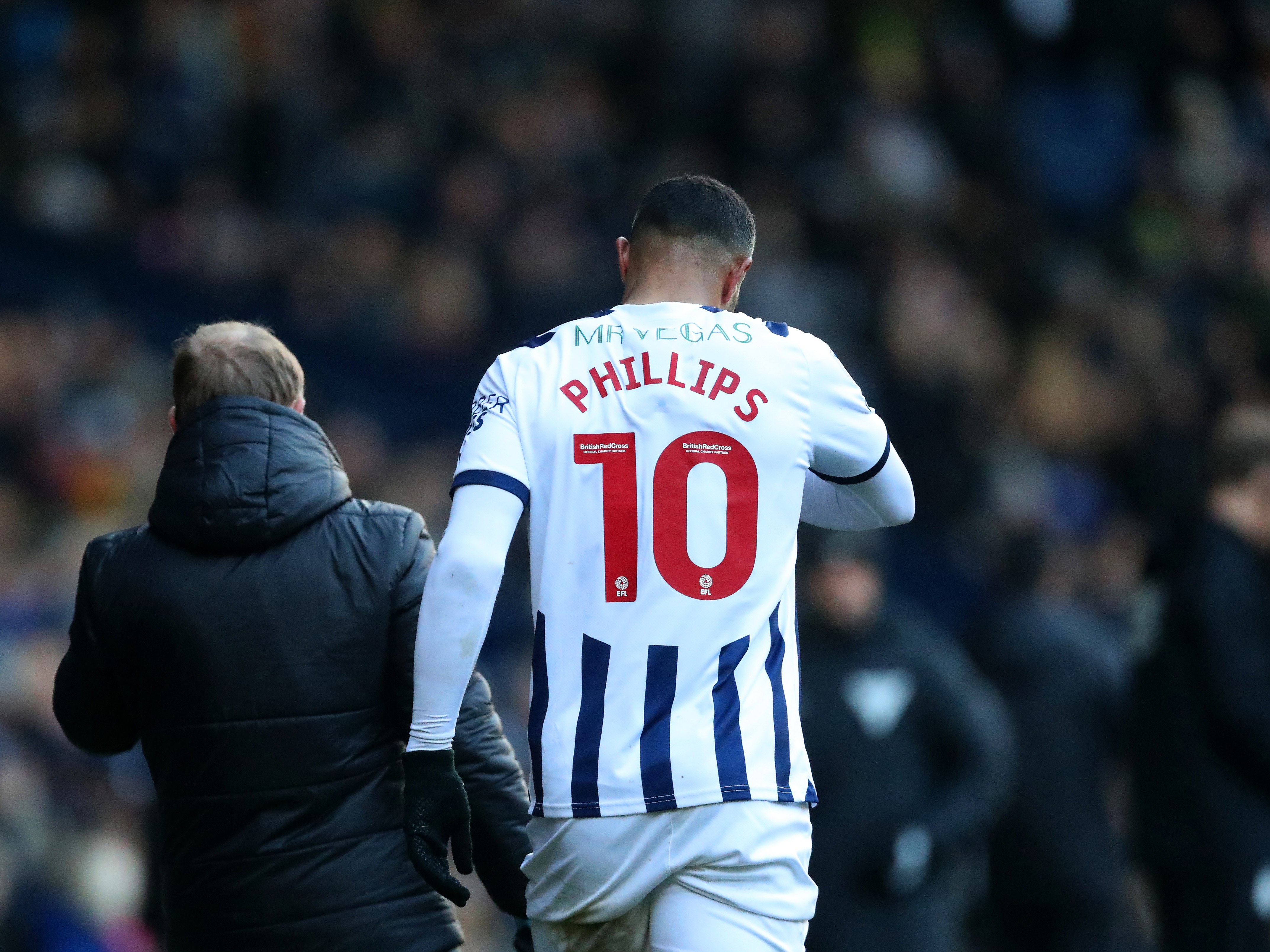 Matty Phillips is taken off after picking up an injury against Leicester