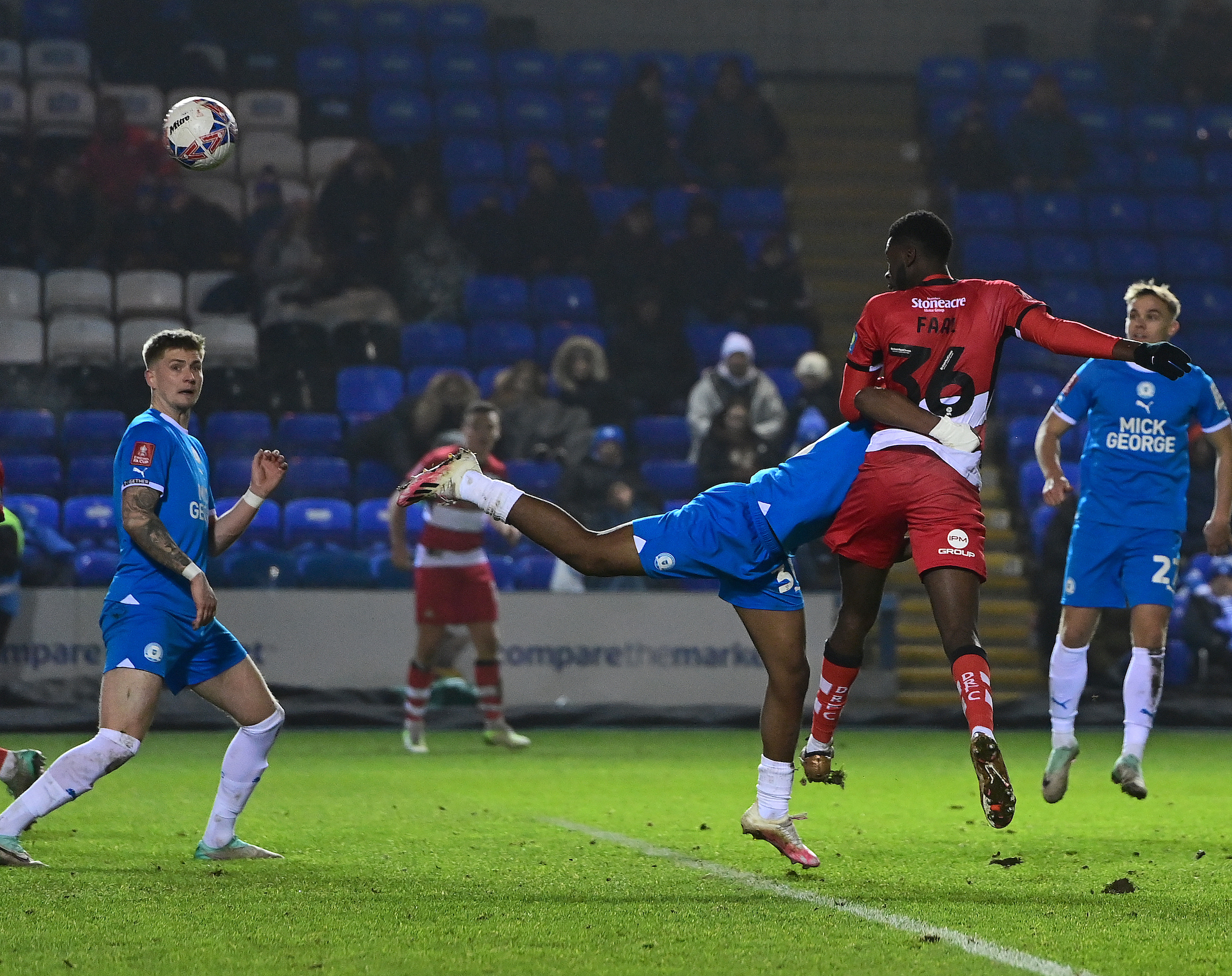 A photo of striker Mo Faal heading in a goal for loan side Doncaster v Peterborough at the Weston Homes Stadium