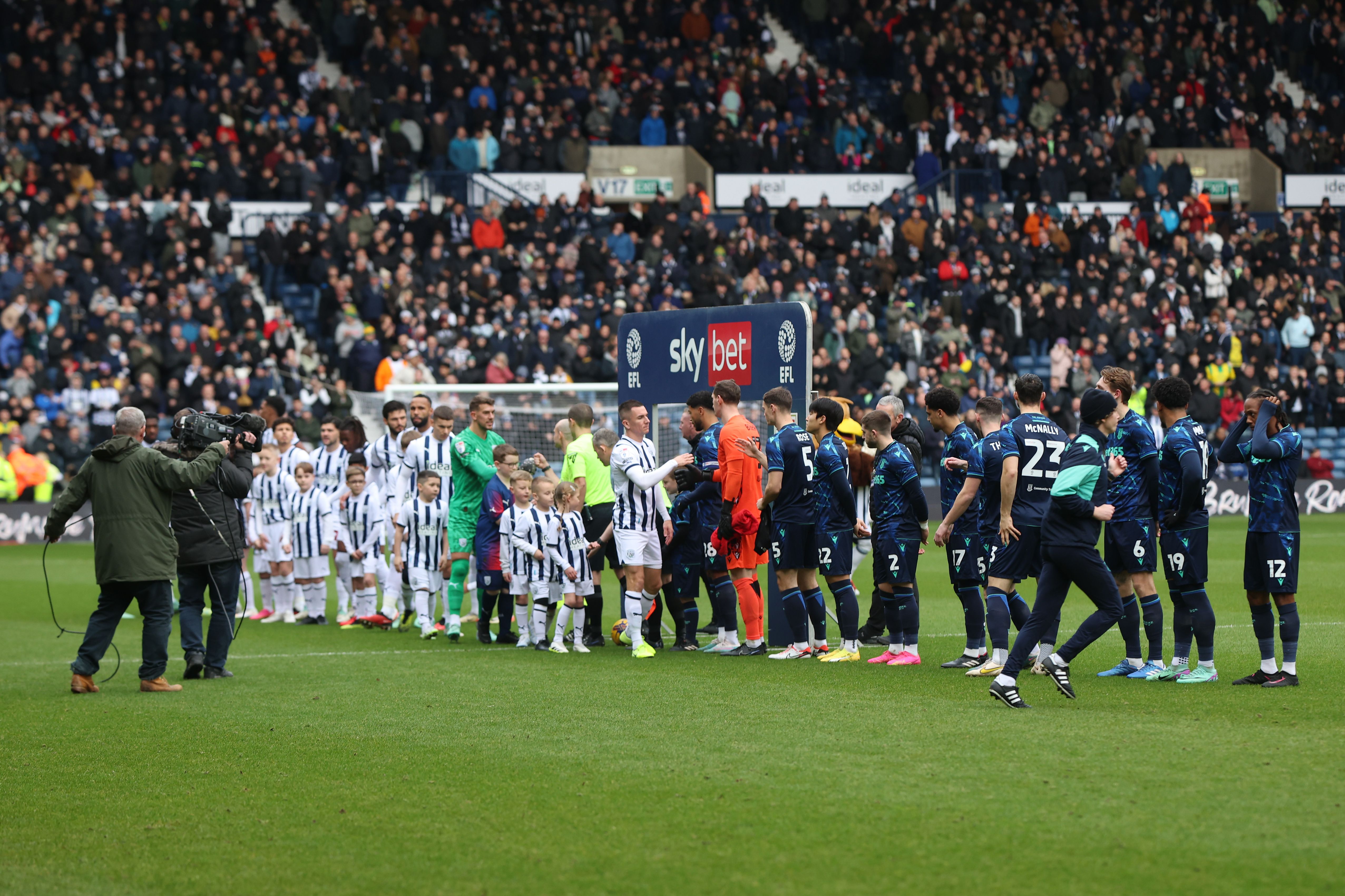 Albion players and Stoke players lining up before the game