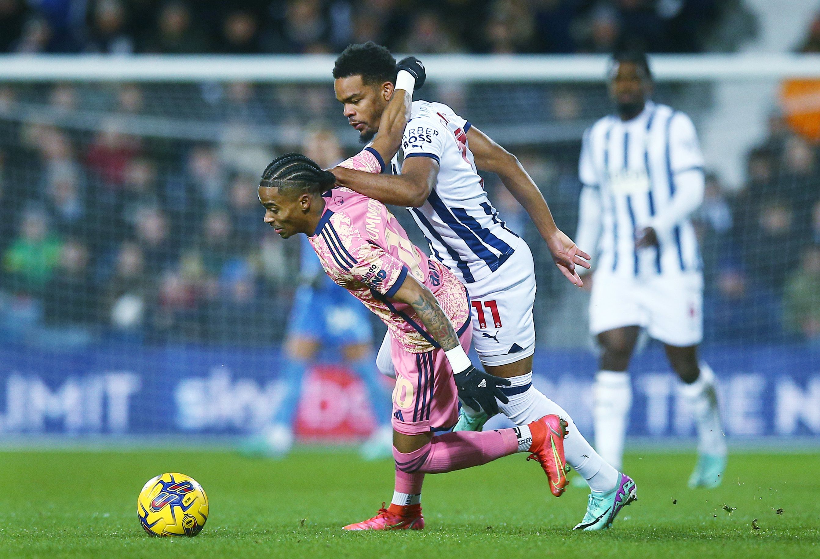 Grady Diangana fights for the ball against Leeds