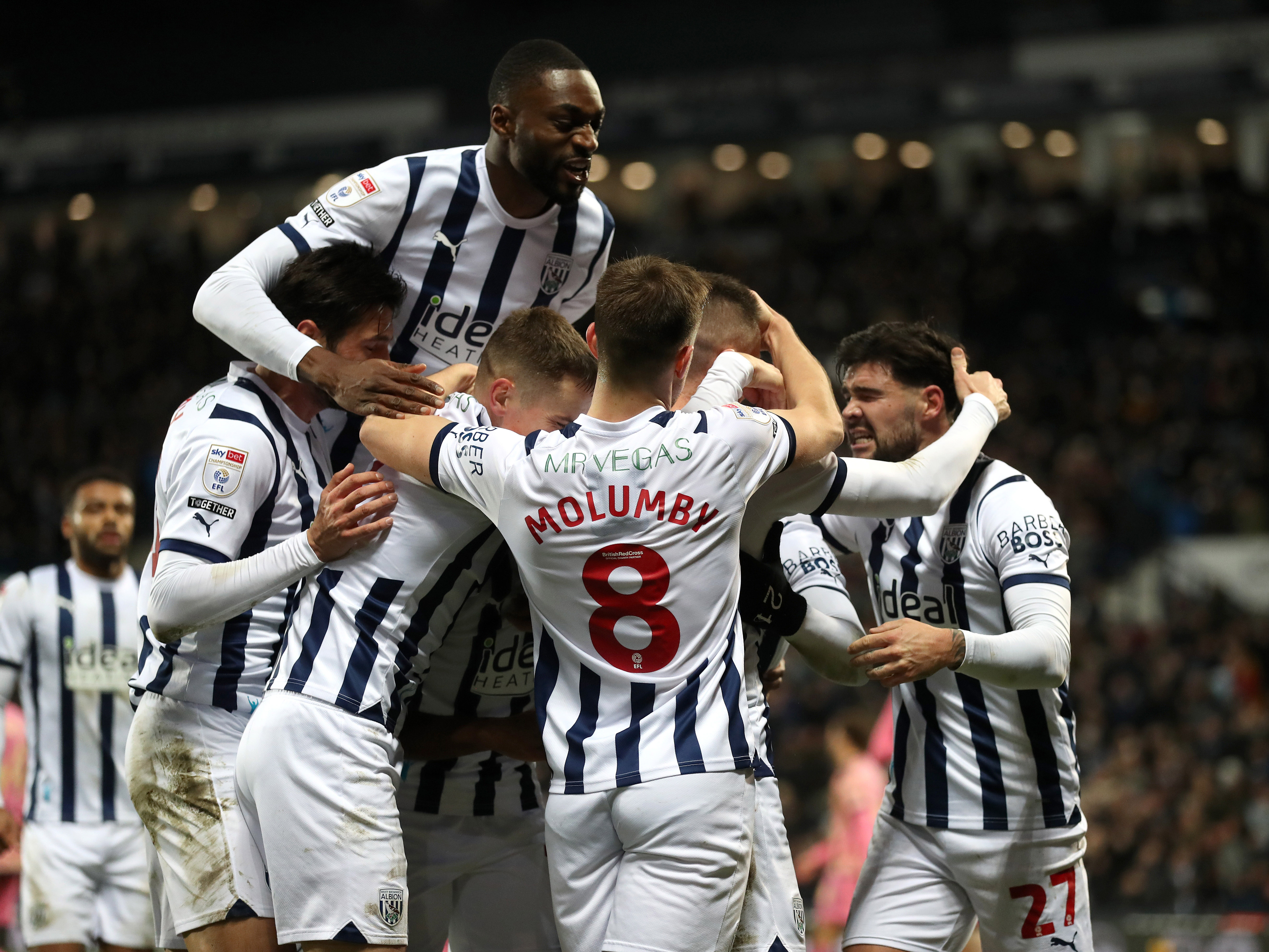 An image of the Albion players celebrating against Leeds