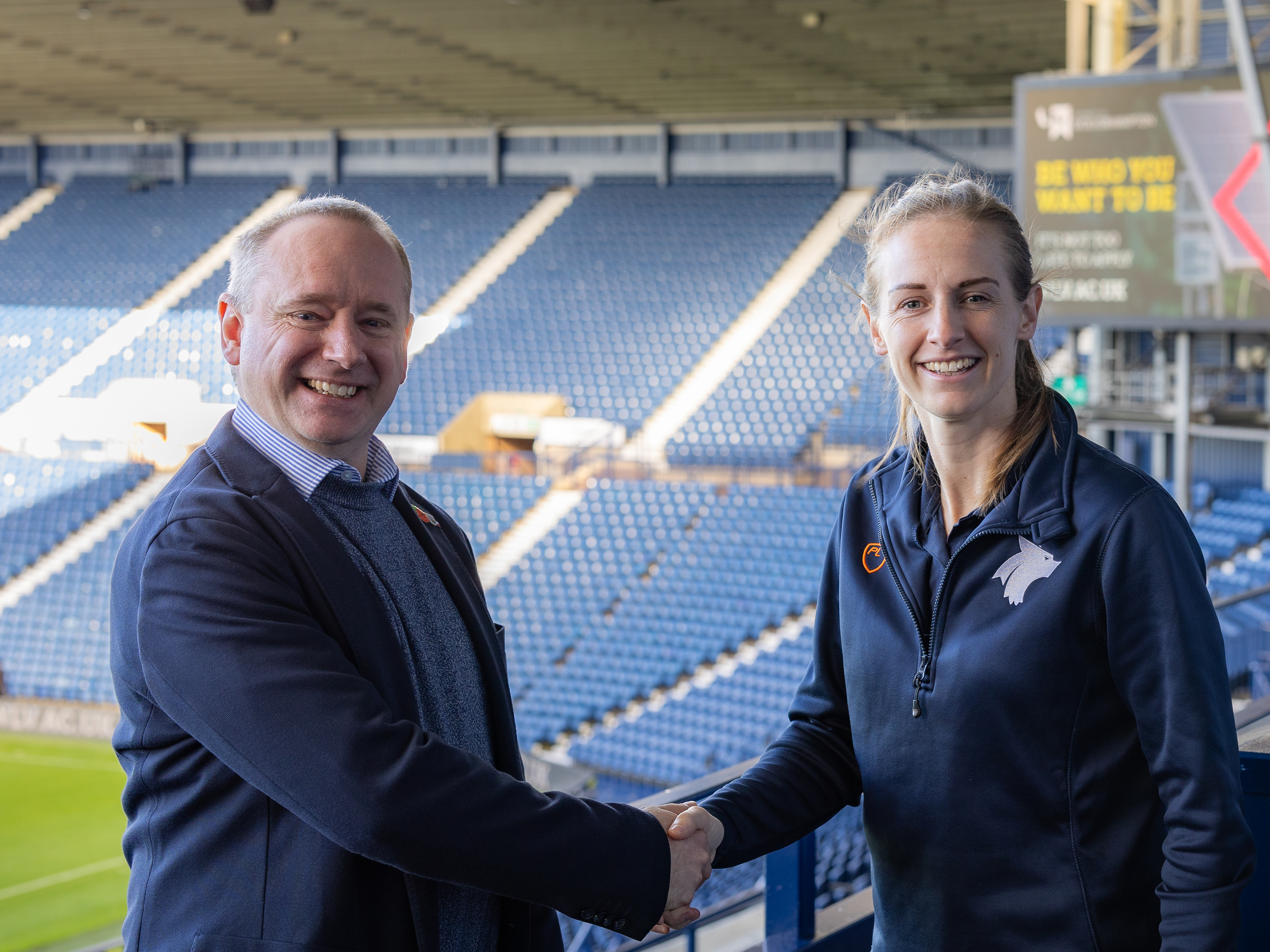 Albion Managing Director Mark Miles shakes hands with Kerys Harrop, former Lioness and Football Coaching and Performance Lecturer at the University of Wolverhampton