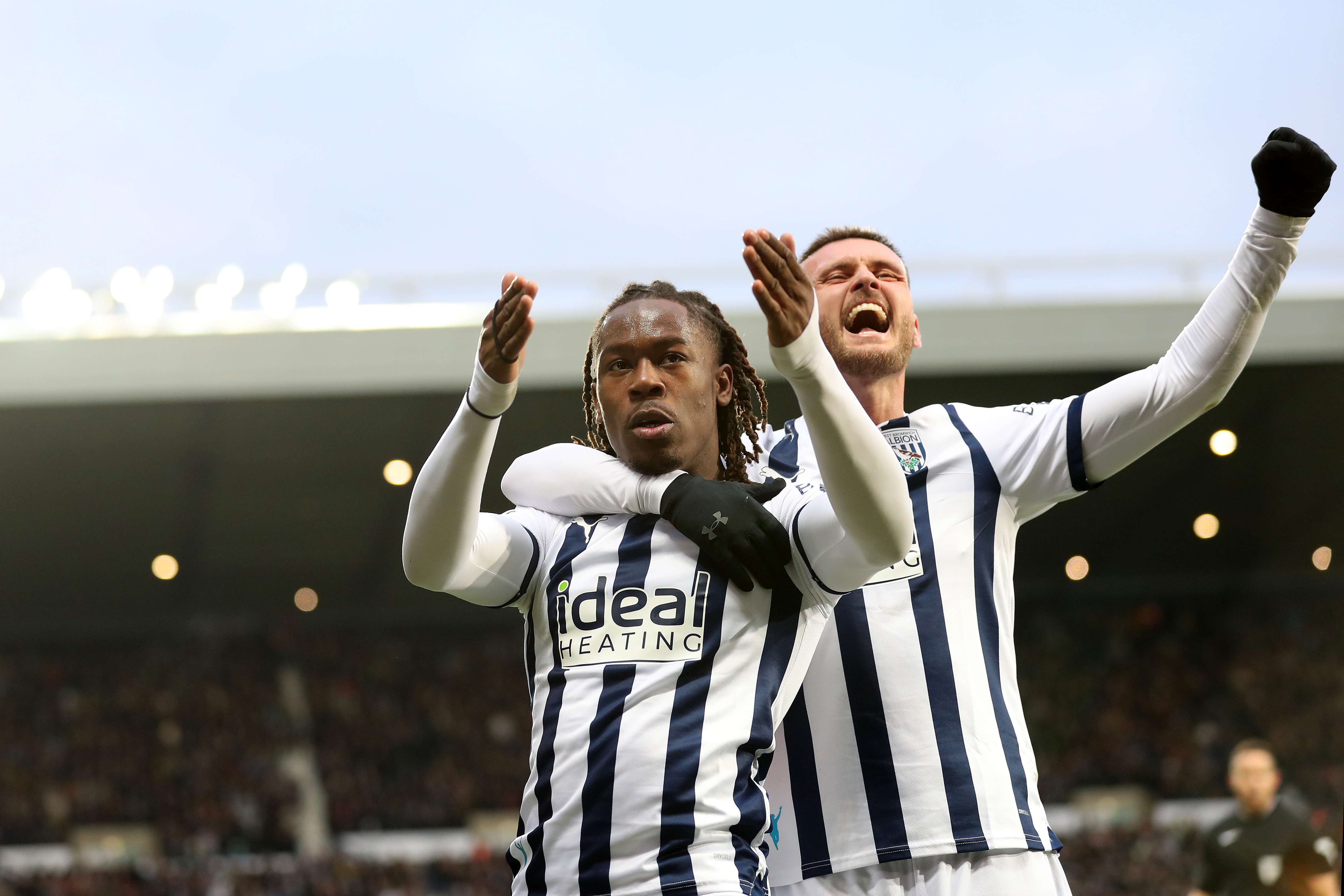 Brandon Thomas-Asante celebrates scoring against Blackburn with John Swift