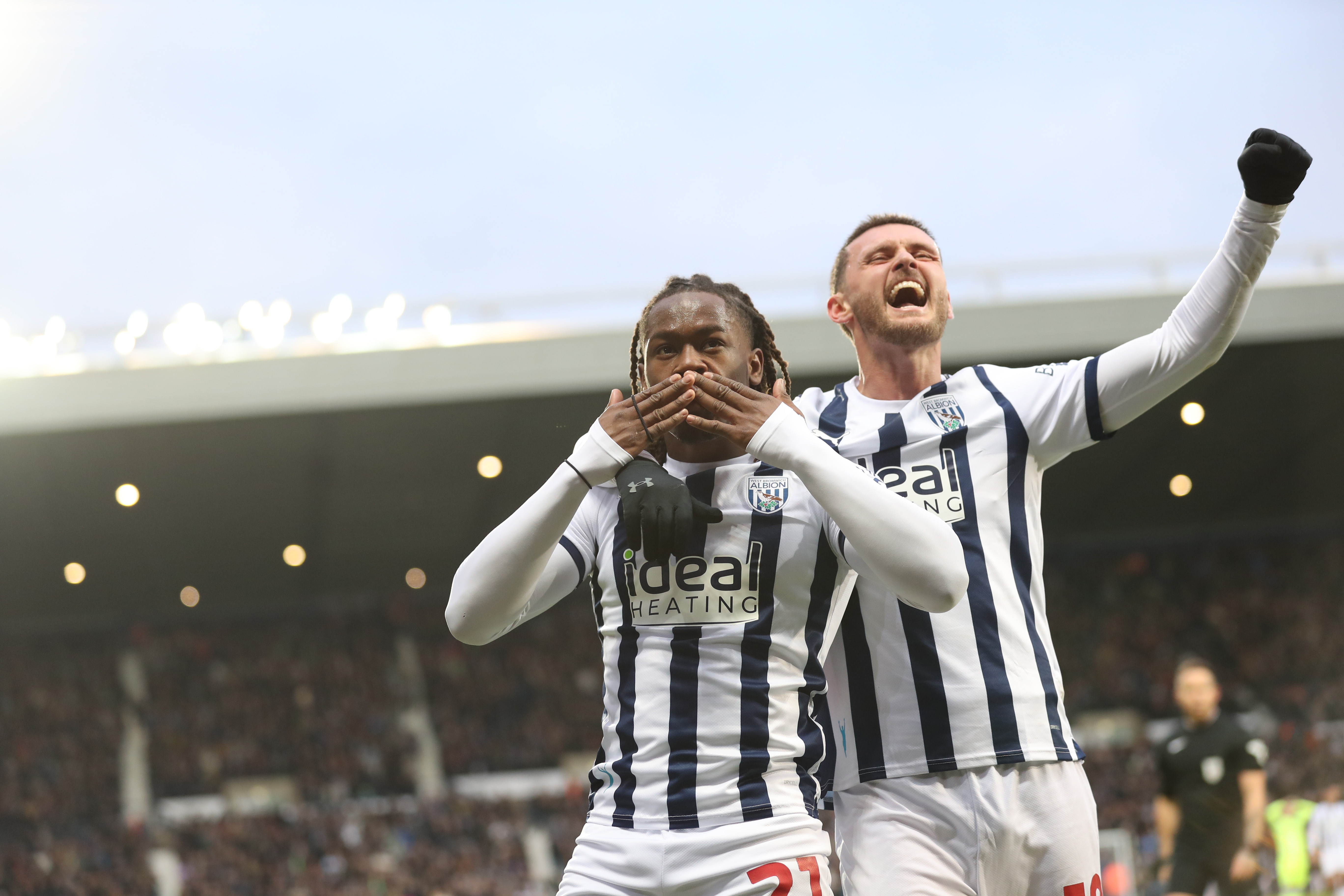 Brandon Thomas-Asante celebrates scoring against Blackburn with John Swift