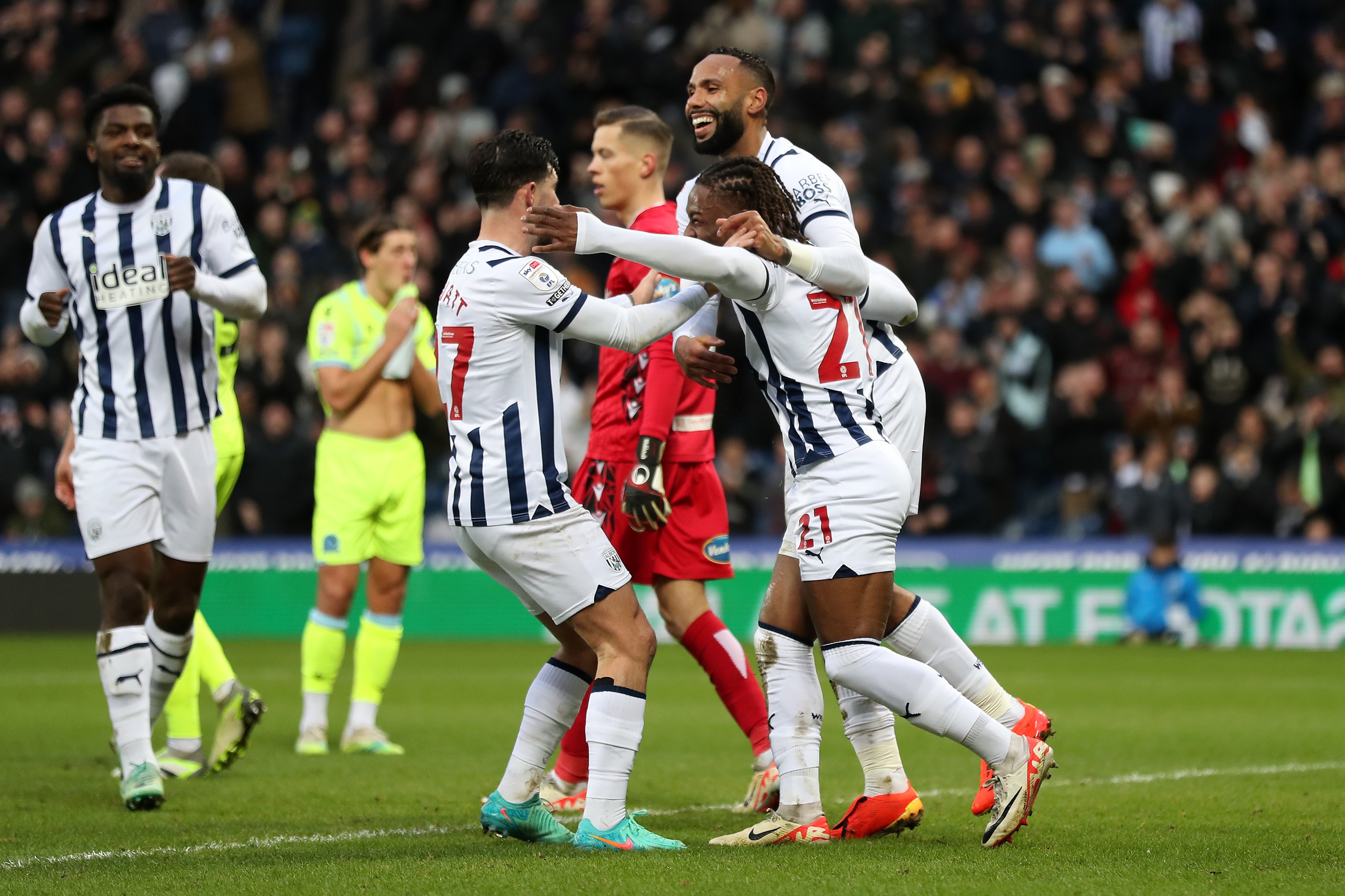 Alex Mowatt, Brandon Thomas-Asante and Kyle Bartley celebrate Albion's third goal against Blackburn