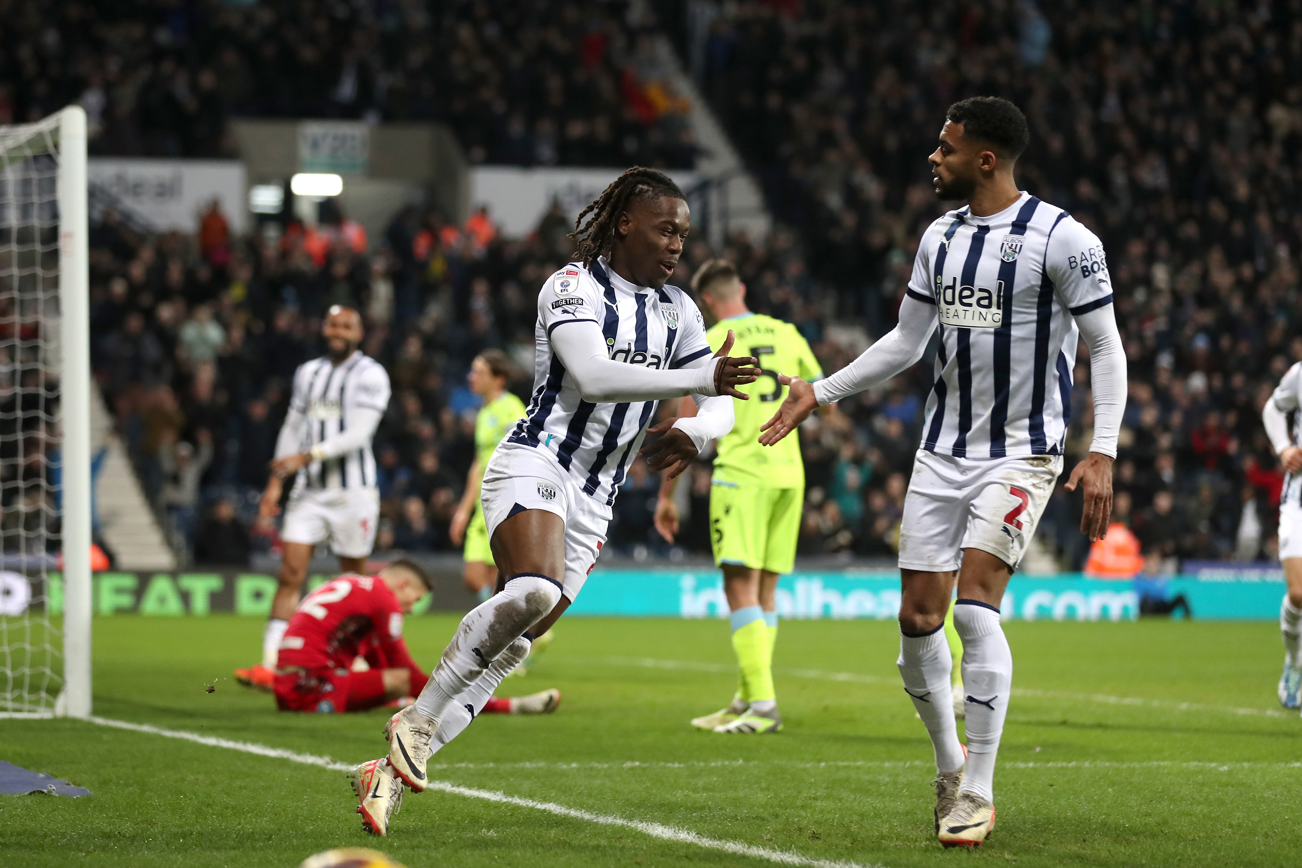 Brandon Thomas-Asante celebrates scoring his second against Blackburn with Darnell Furlong