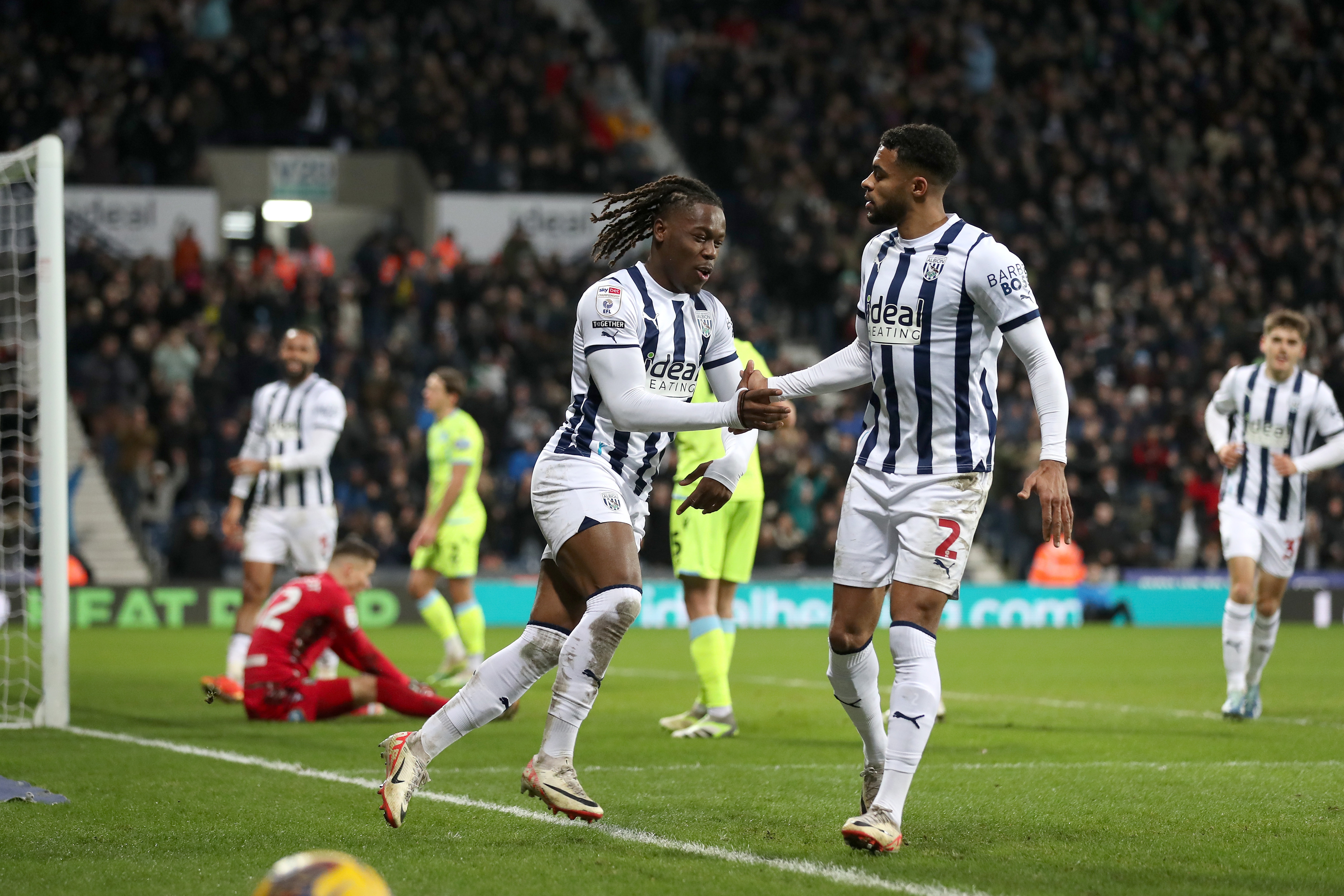 Brandon Thomas-Asante celebrates scoring his second against Blackburn with Darnell Furlong