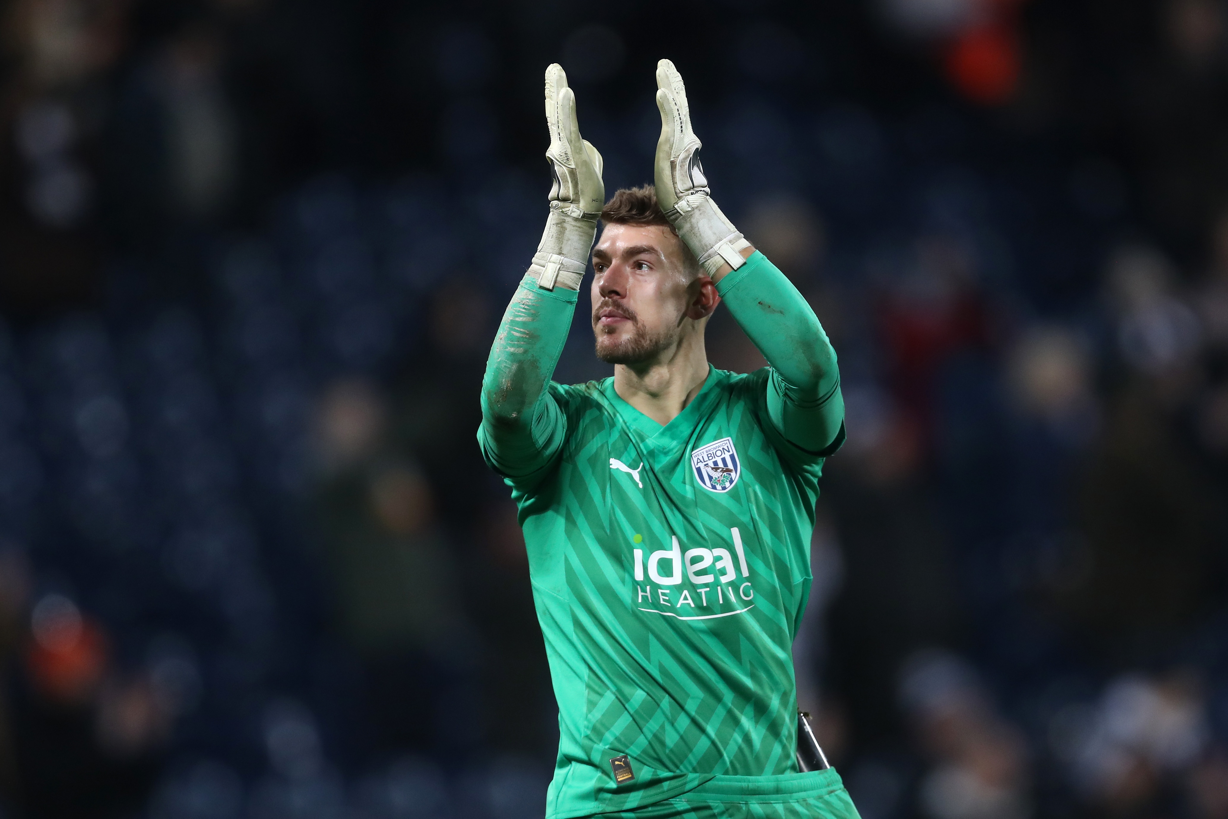 Alex Palmer applauds supporters after full time against Blackburn