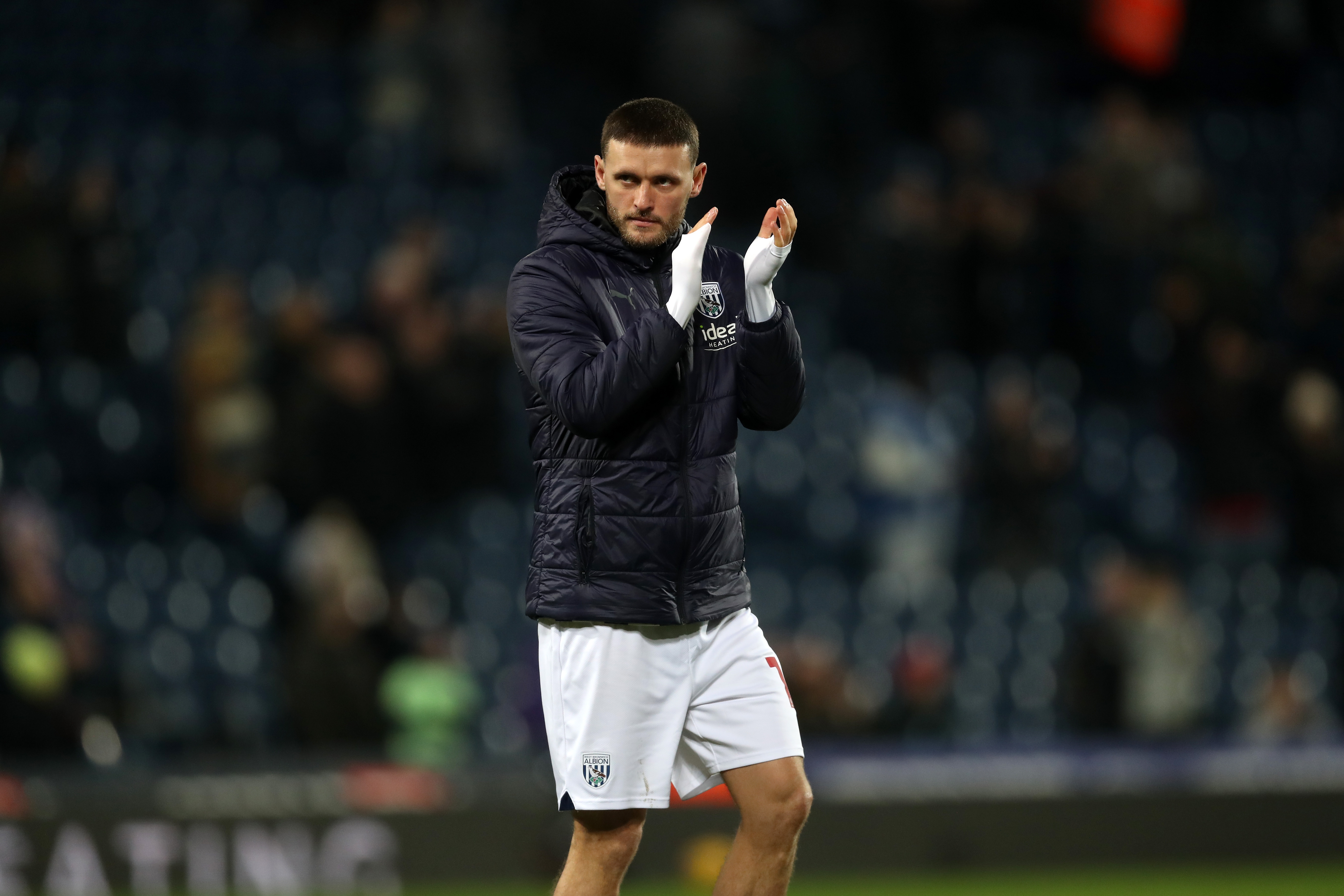 John Swift applauds supporters after full time against Blackburn