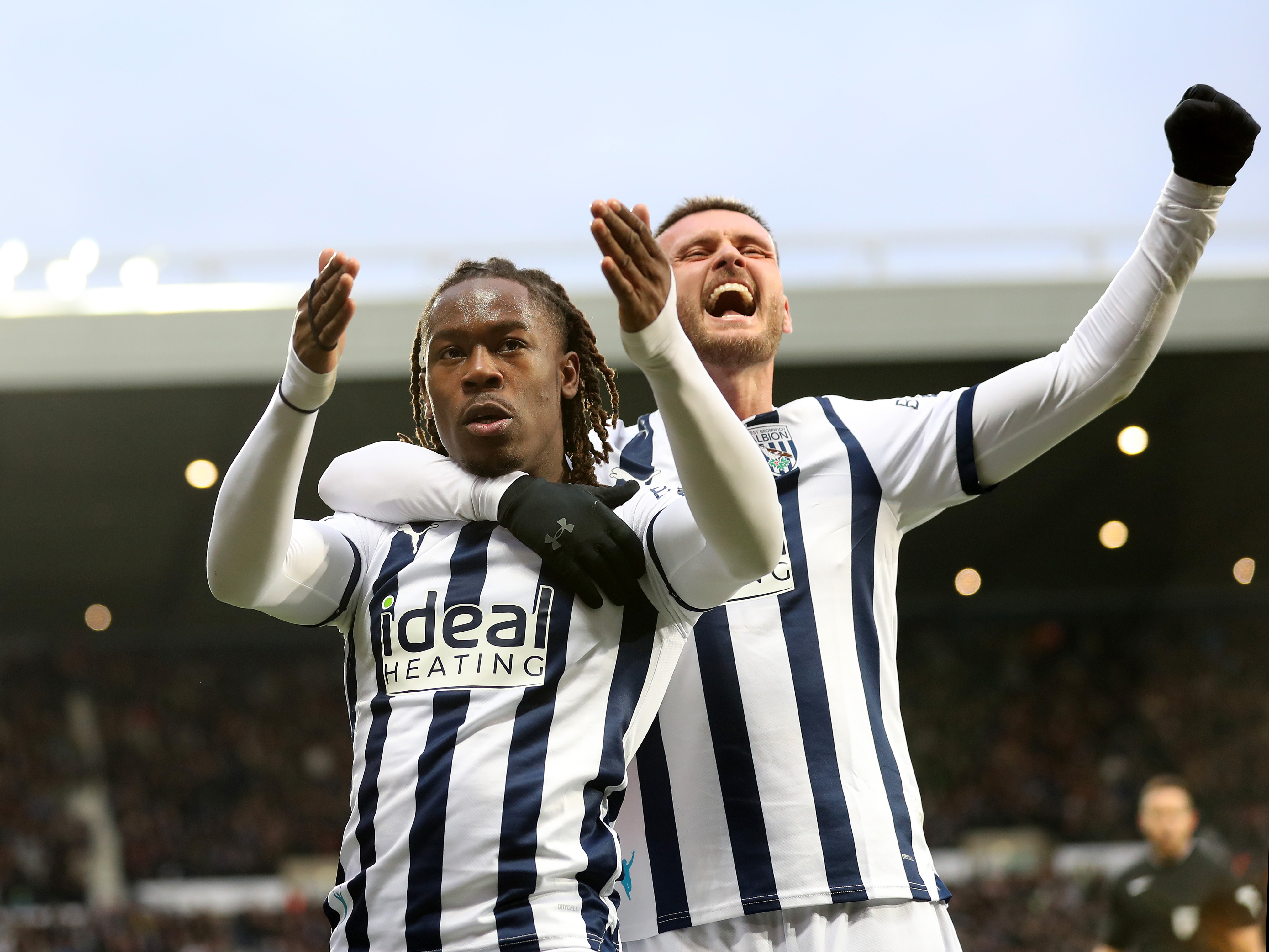 Brandon Thomas-Asante celebrates with John Swift after scoring against Blackburn 