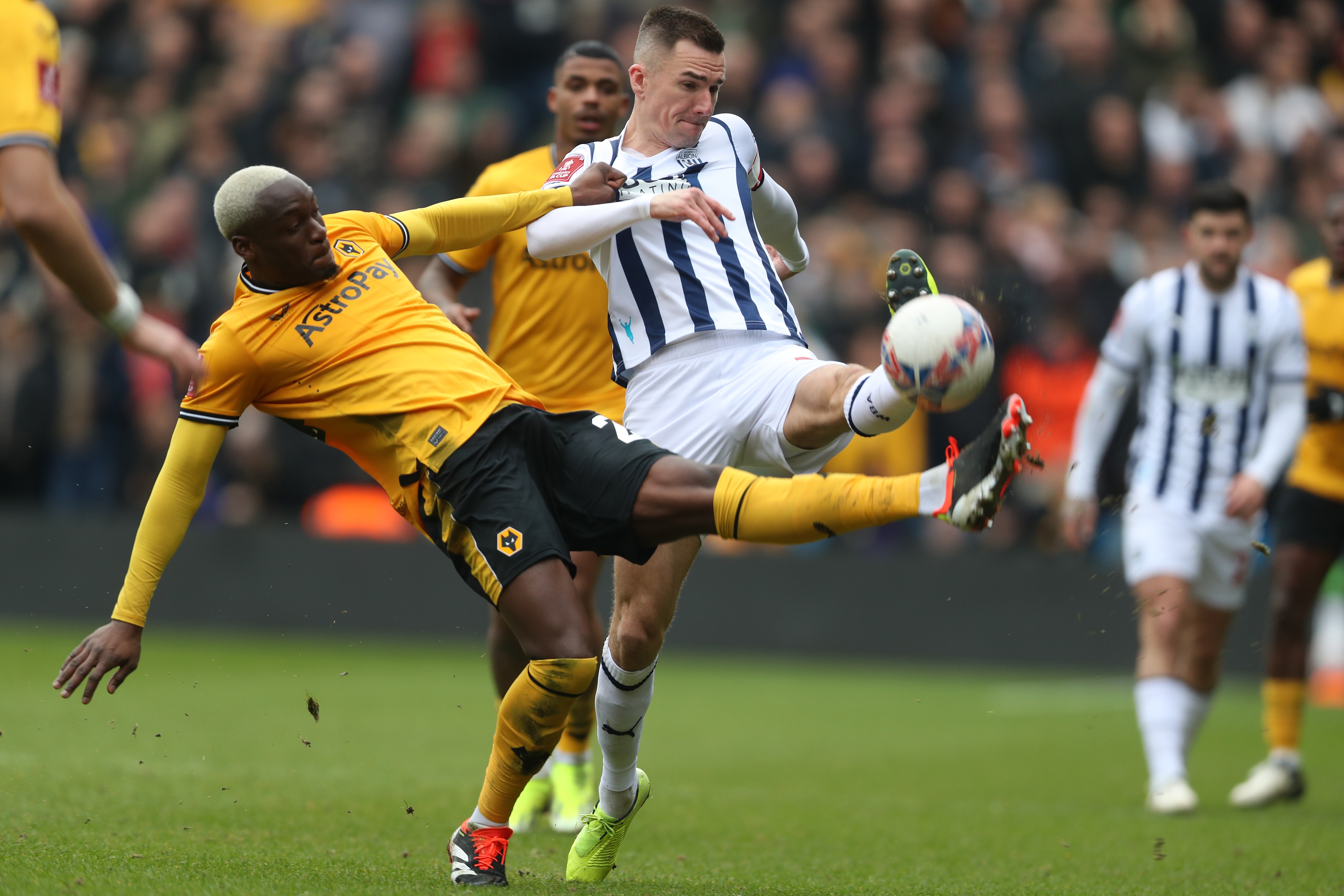 Jed Wallace fights for the ball against Wolves