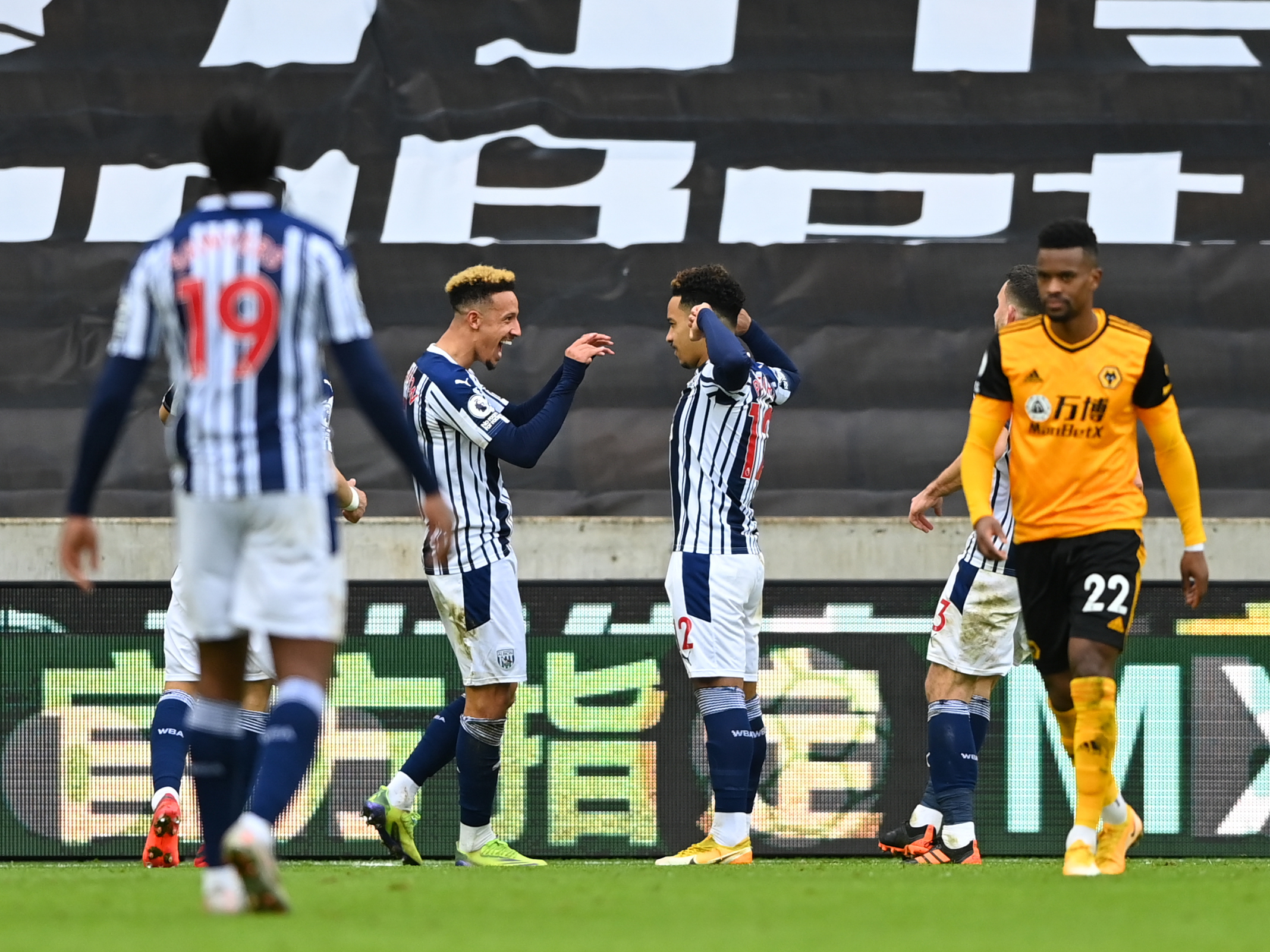 Callum Robinson celebrates with Matheus Pereira after the Brazilian's goal at Wolves in January 2021