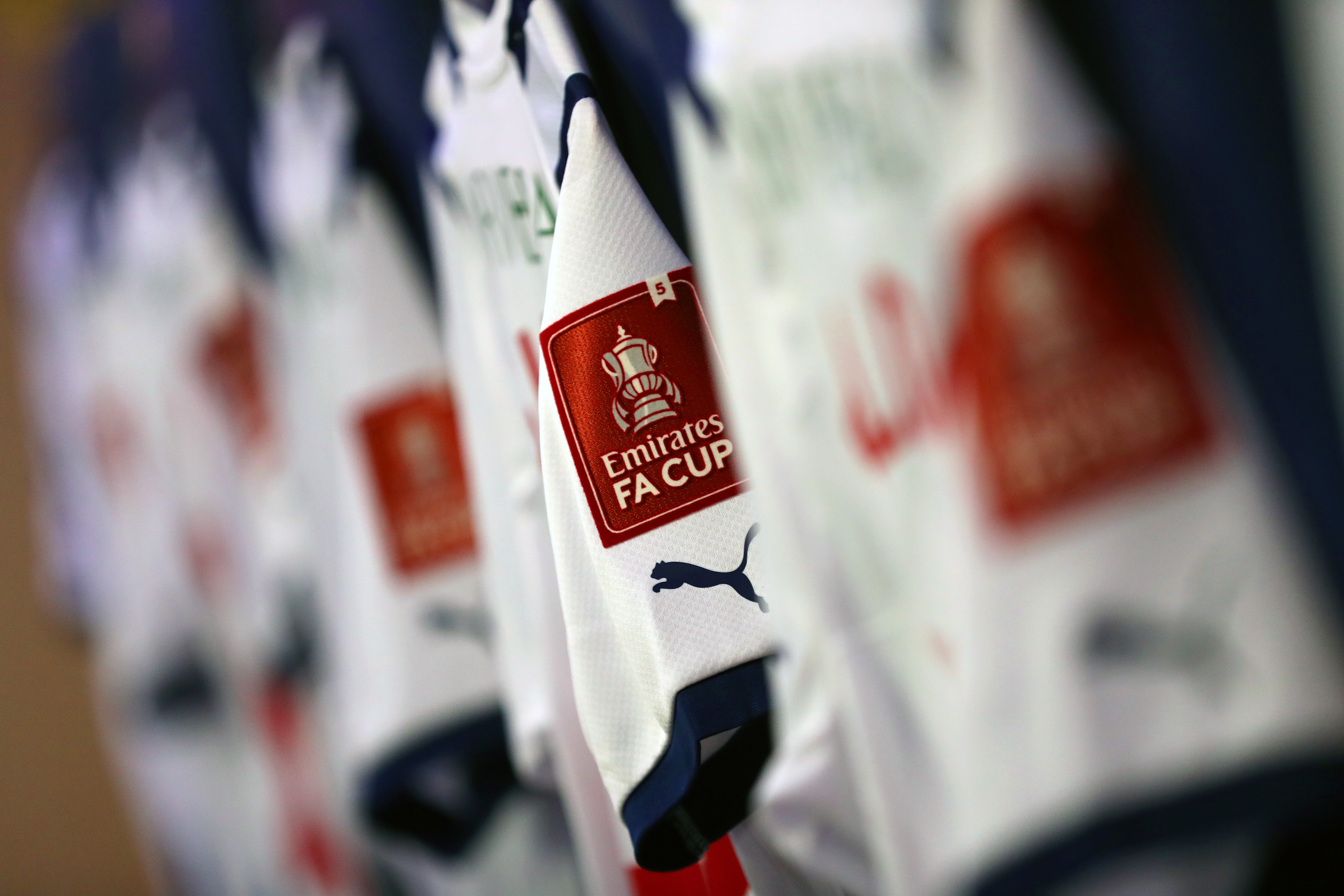 An FA Cup logo on the sleeve of an Albion home shirt