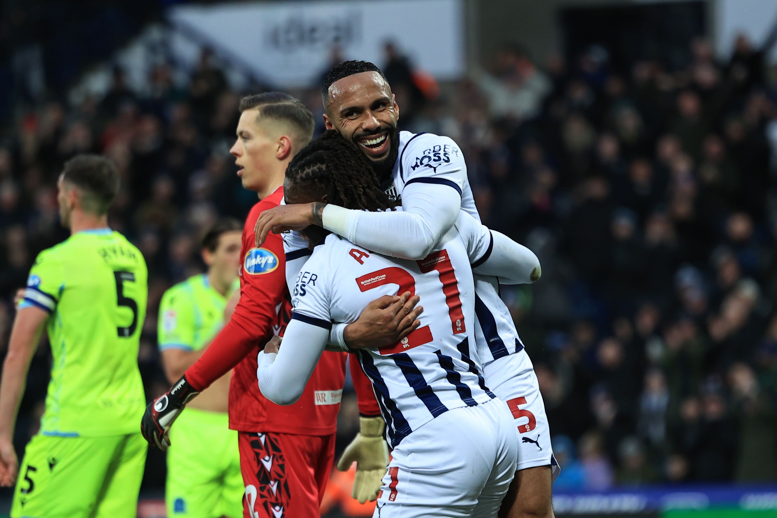 Brandon Thomas-Asante and Kyle Bartley celebrate Albion's third goal against Blackburn 