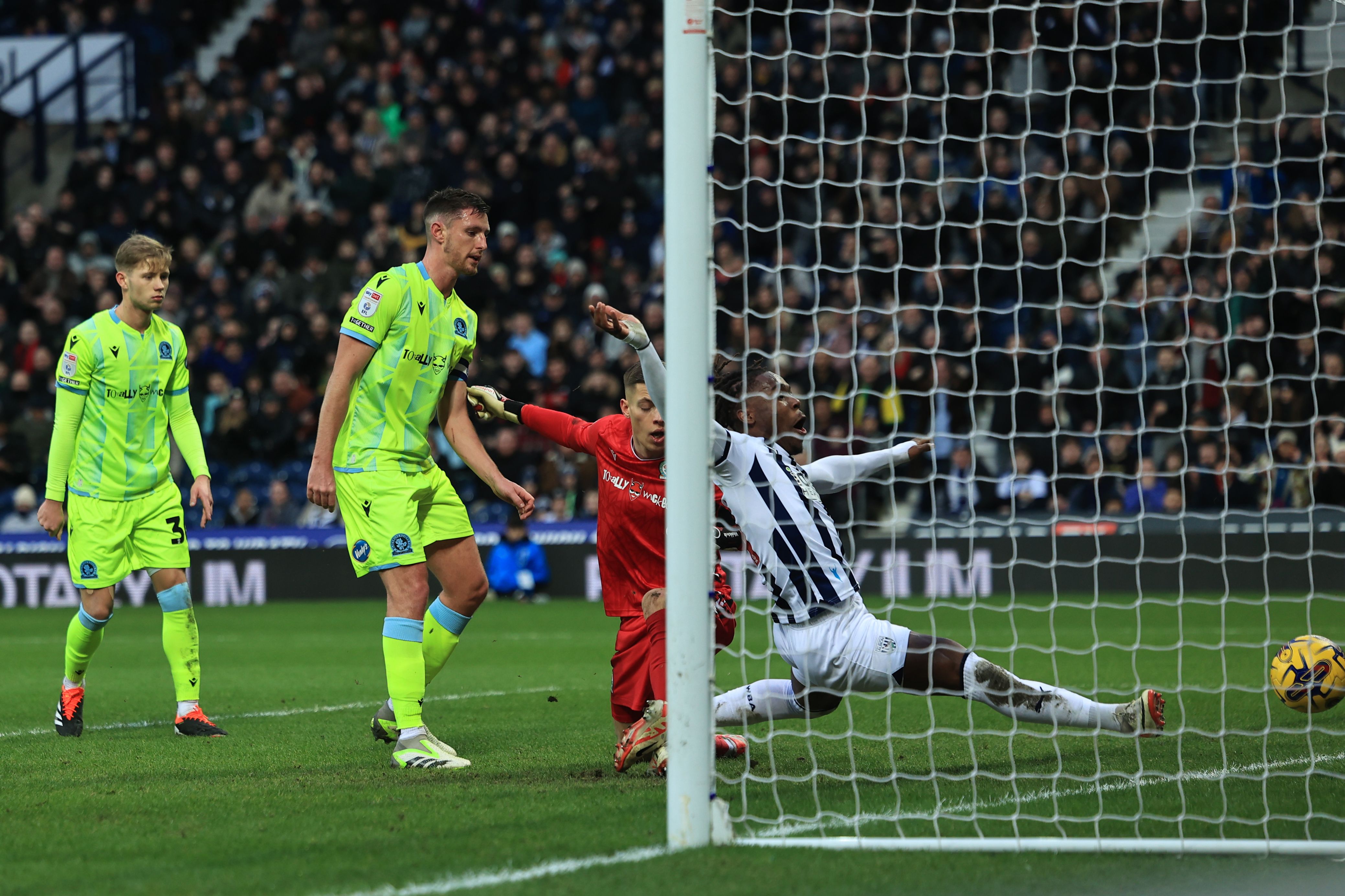 Brandon Thomas-Asante stretches for the ball on the goaline 