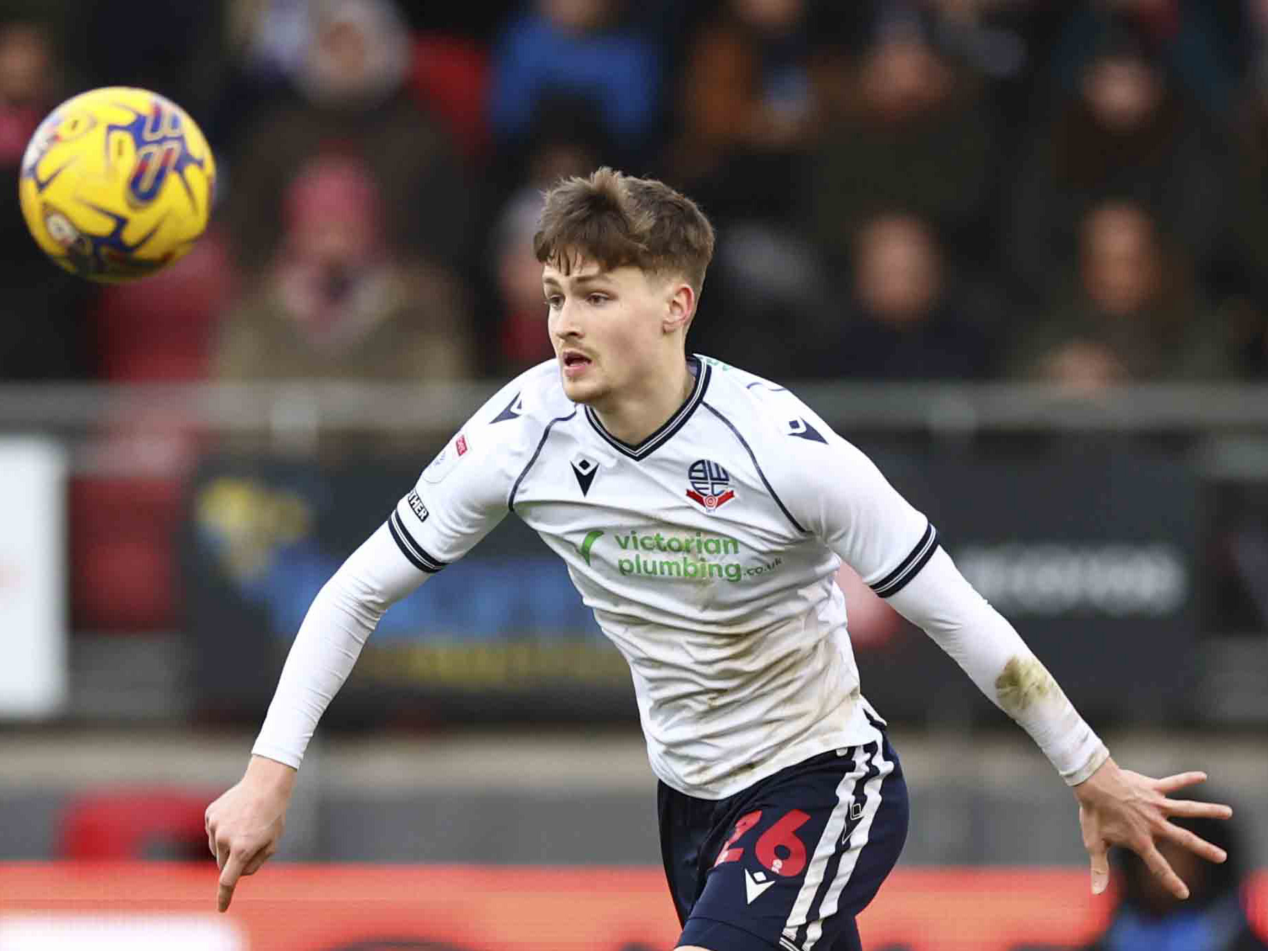 Zac Ashworth chasing the ball while playing for Bolton Wanderers 