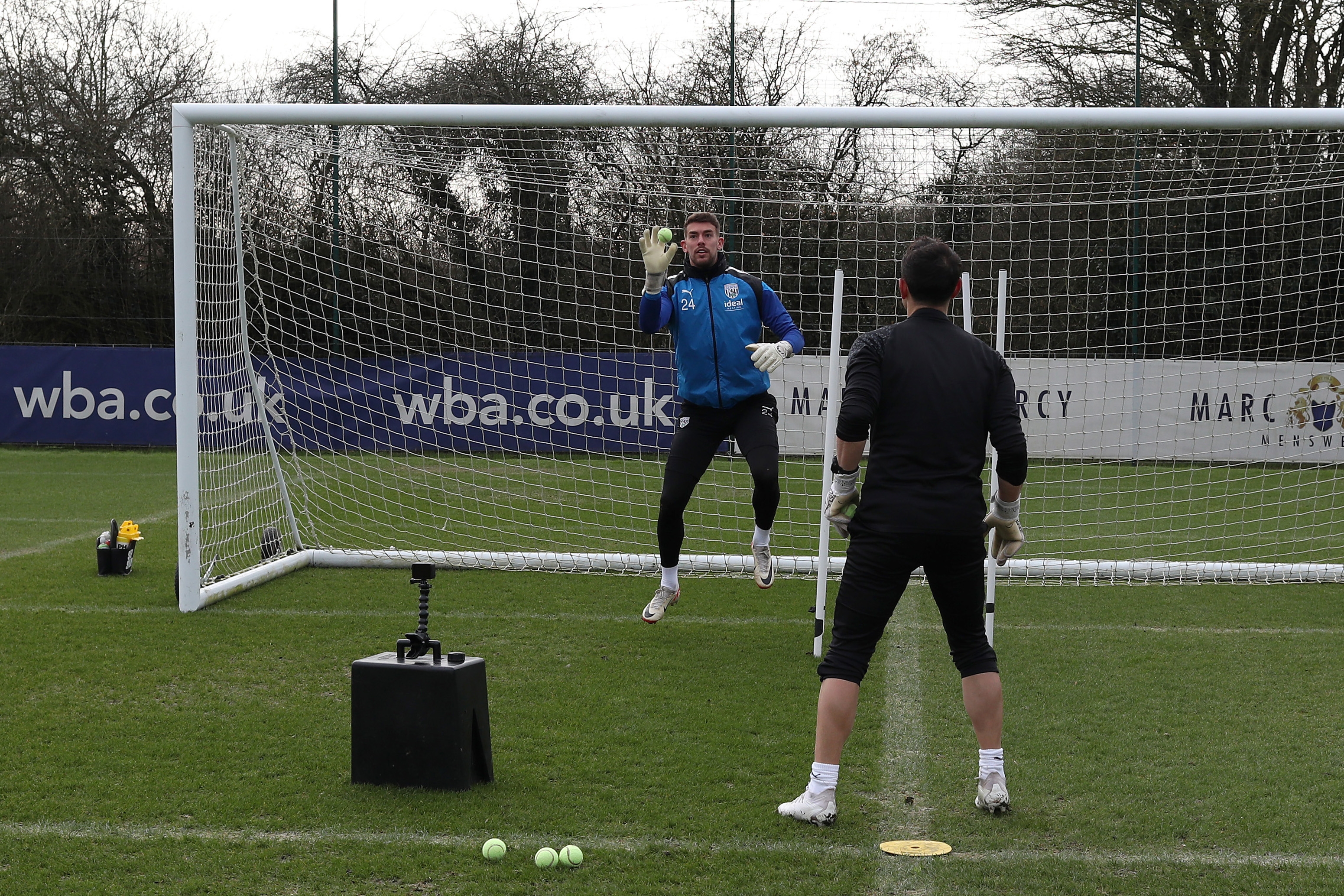 Alex Palmer working with a tennis ball and goalkeeping coach Marcos Abad