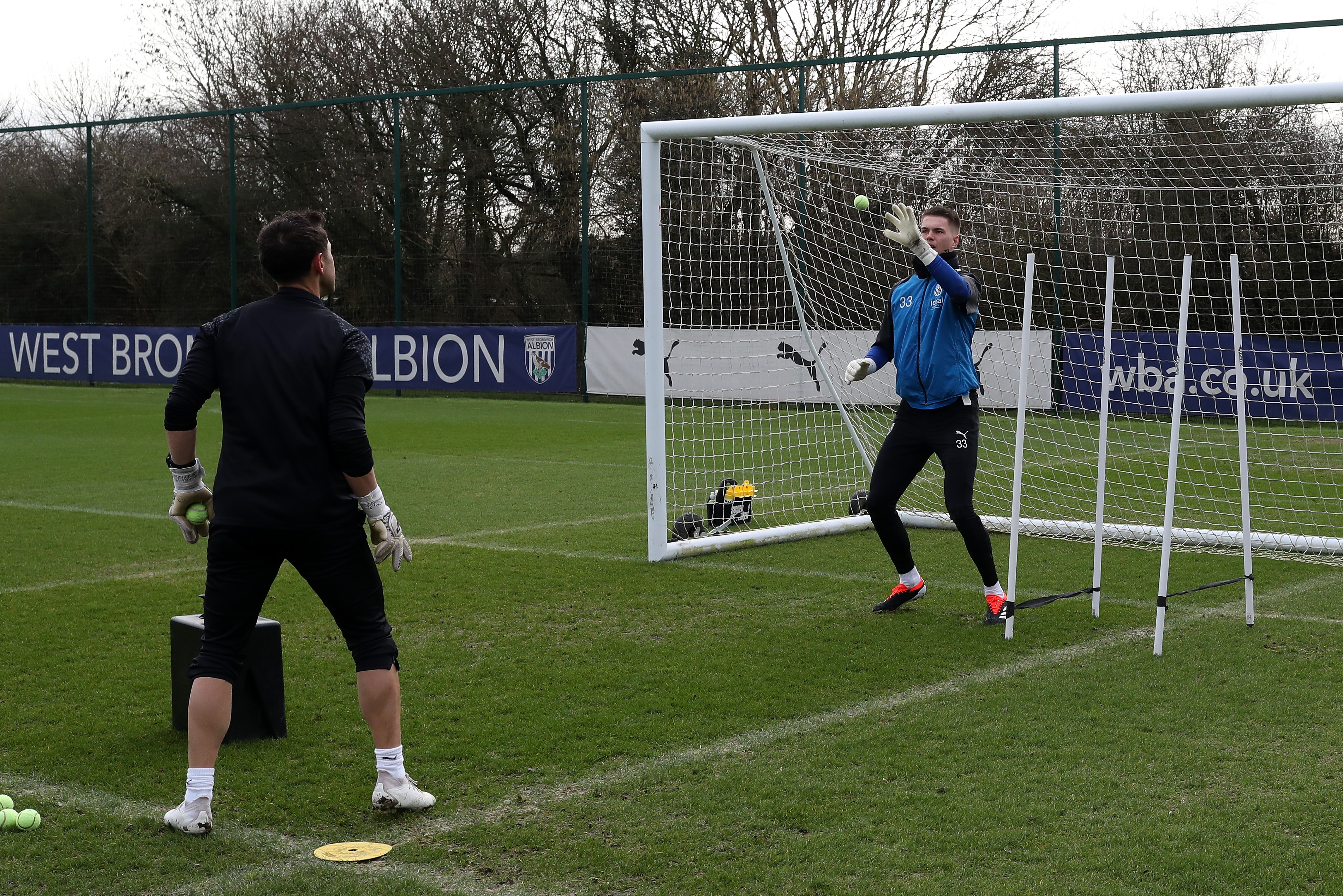 Josh Griffiths working with a tennis ball and goalkeeping coach Marcos Abad