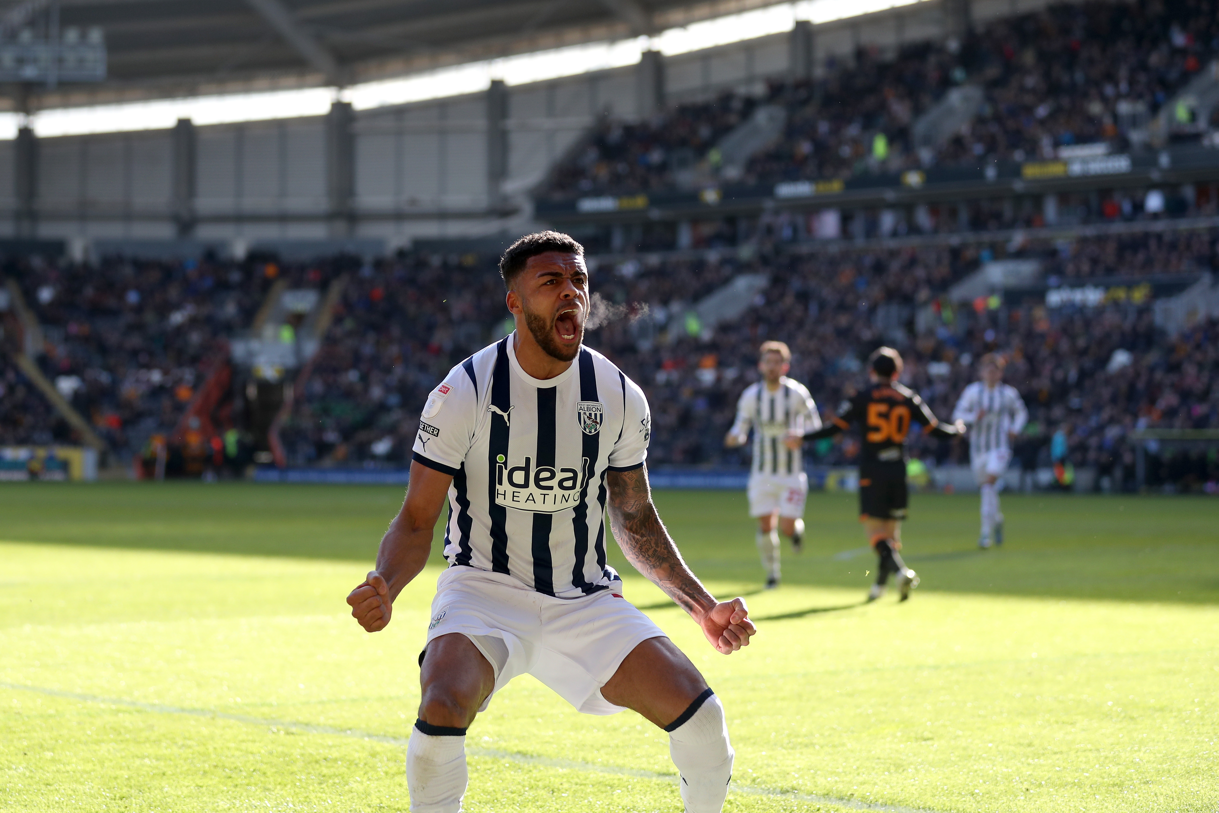 Darnell Furlong celebrates his goal against Hull in front of the Albion fans