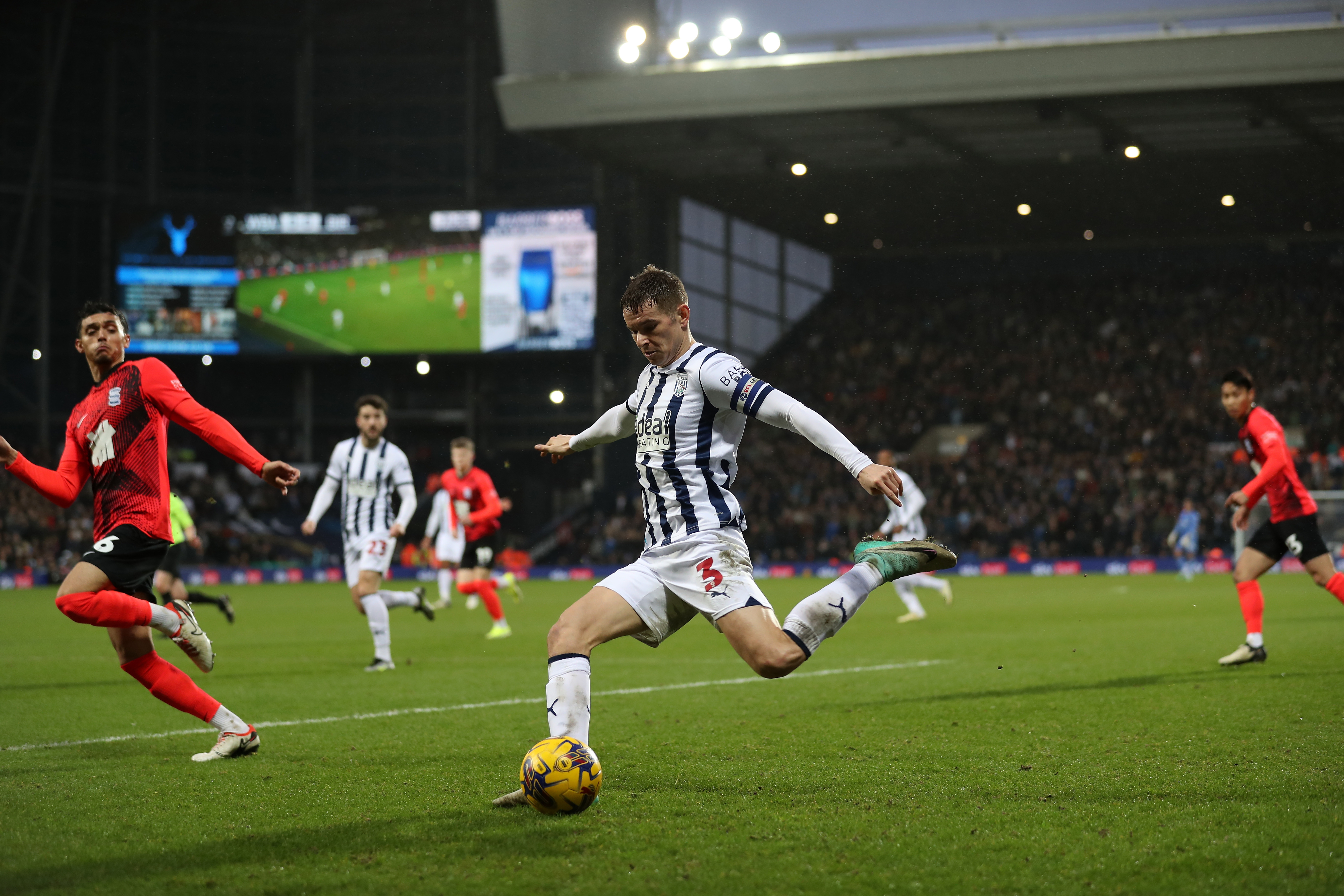 Conor Townsend crosses the ball against Blues