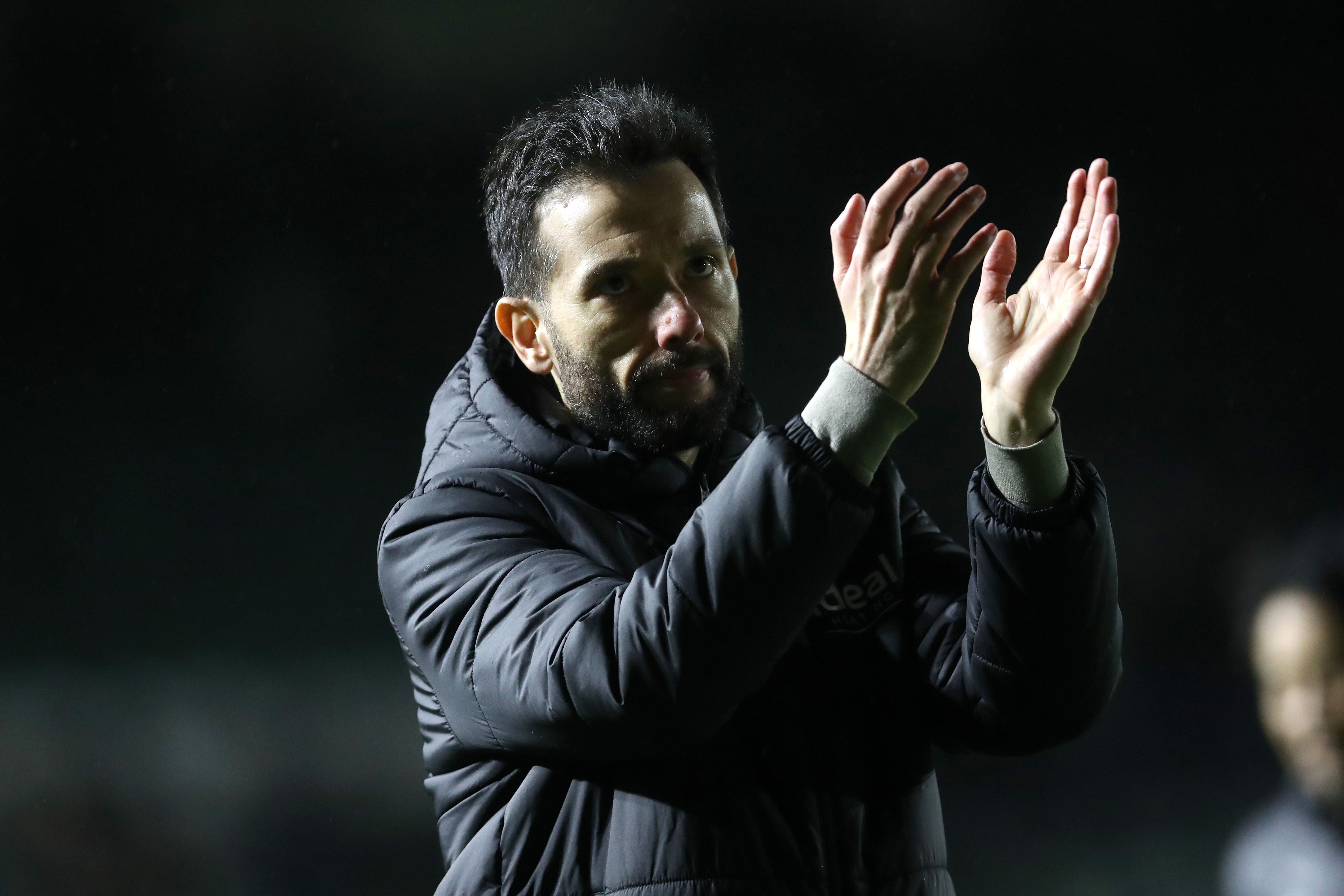 Carlos Corberán applauds Albion fans after the full-time whistle at Plymouth