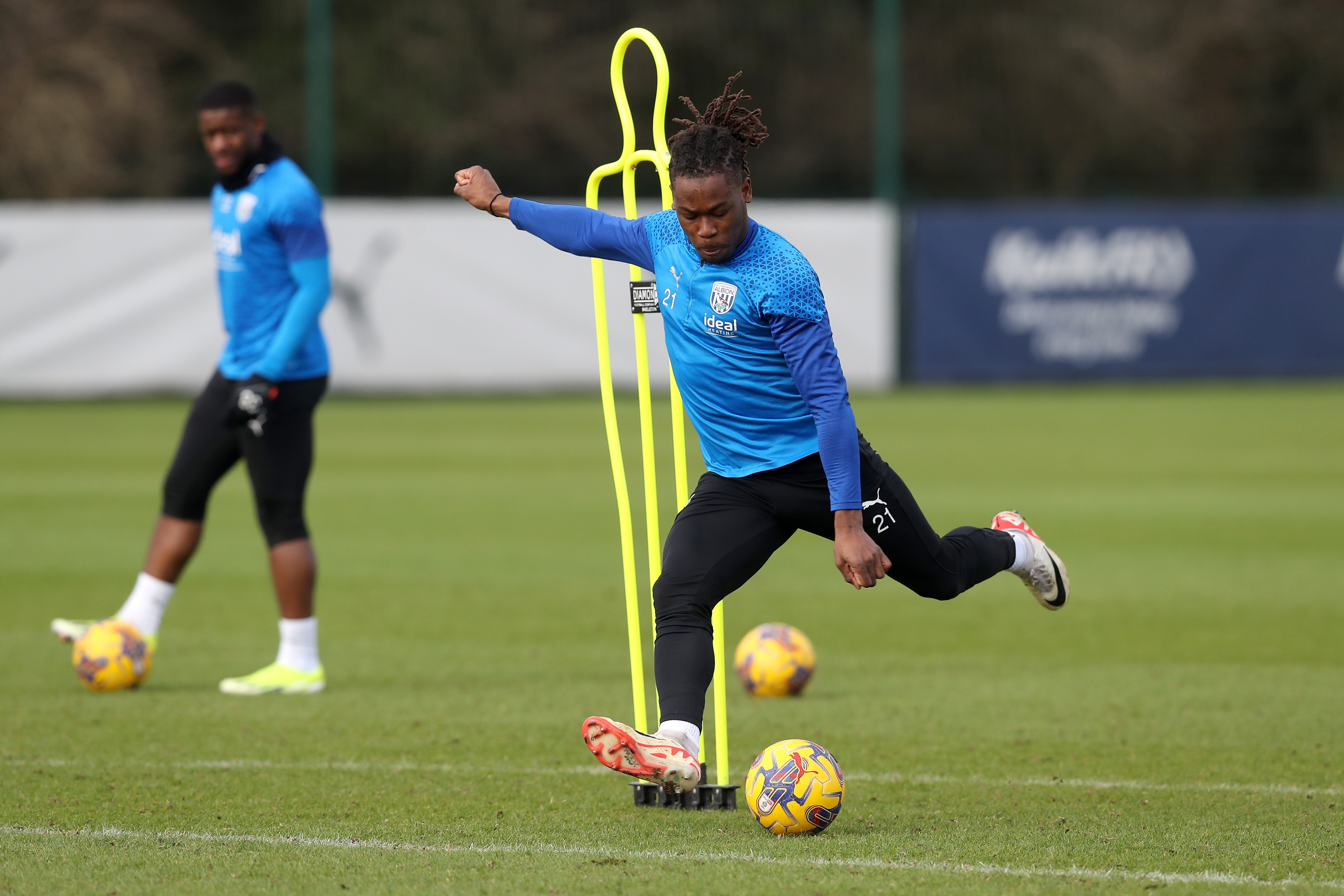 Brandon Thomas-Asante striking the ball in training 