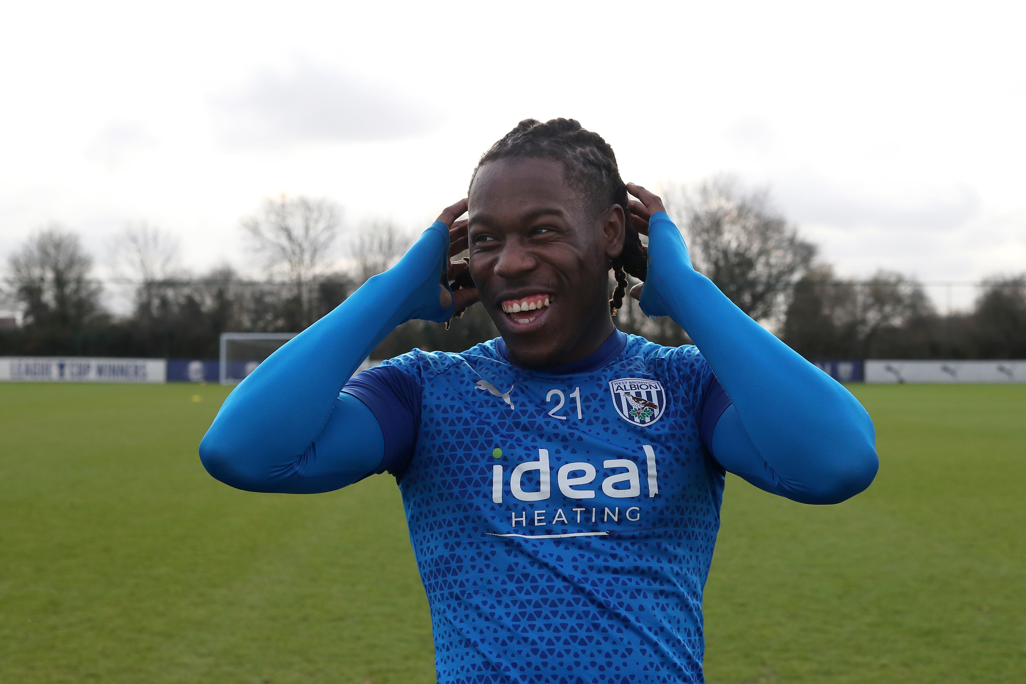 Brandon Thomas-Asante smiling during a training session