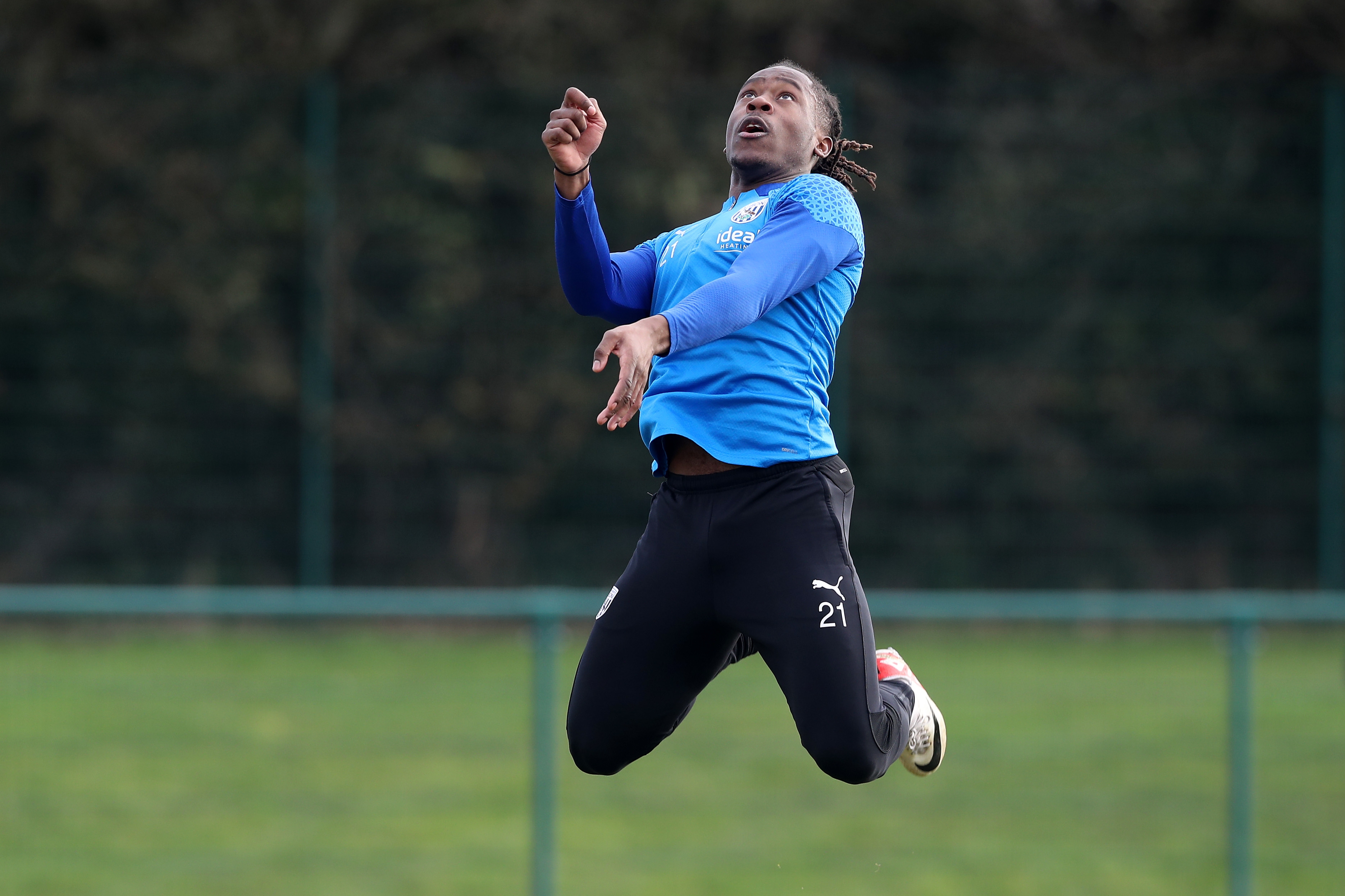 Brandon Thomas-Asante leaping in the air in training 
