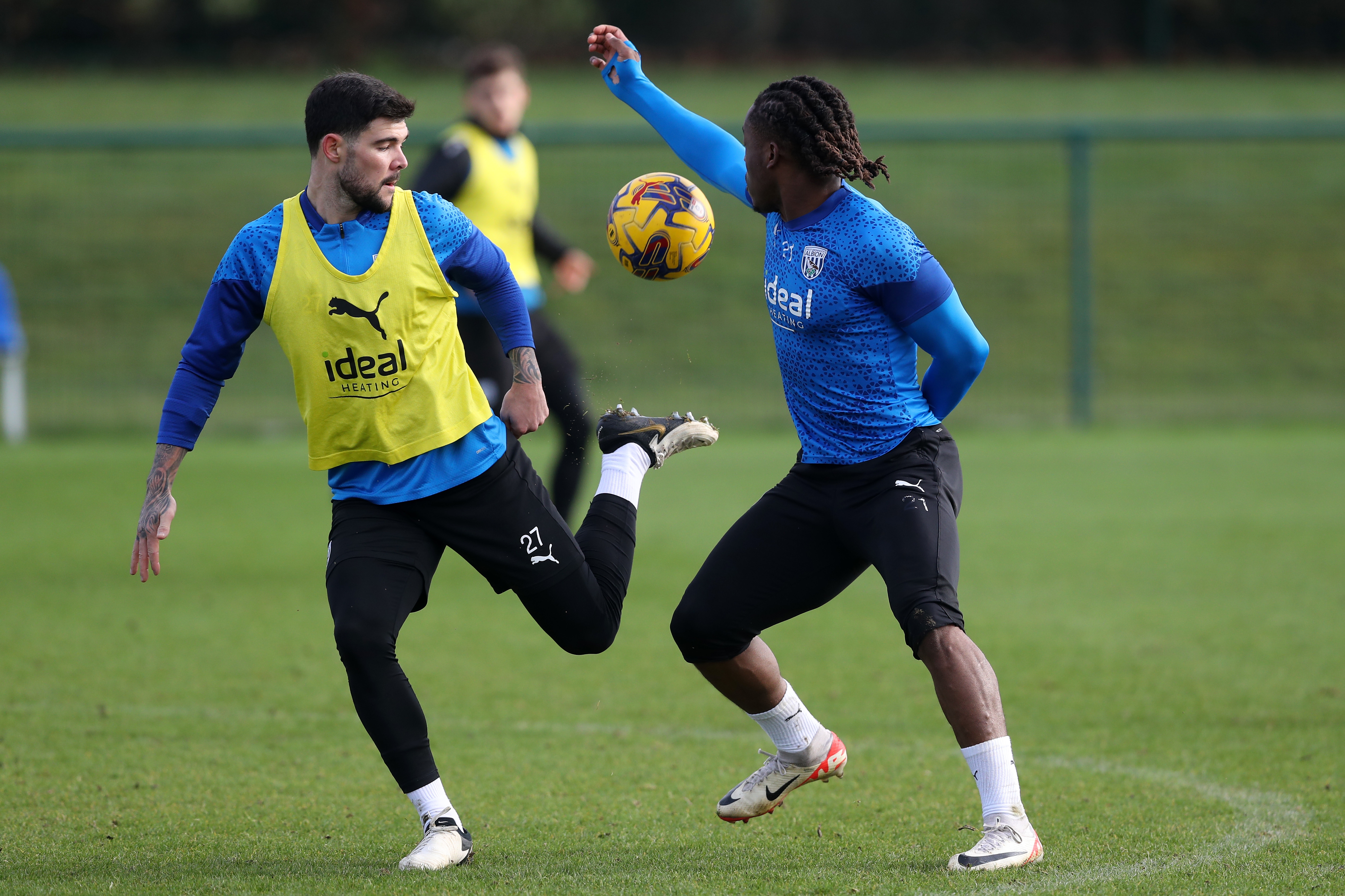 Brandon Thomas-Asante and Alex Mowatt battle for the ball during training
