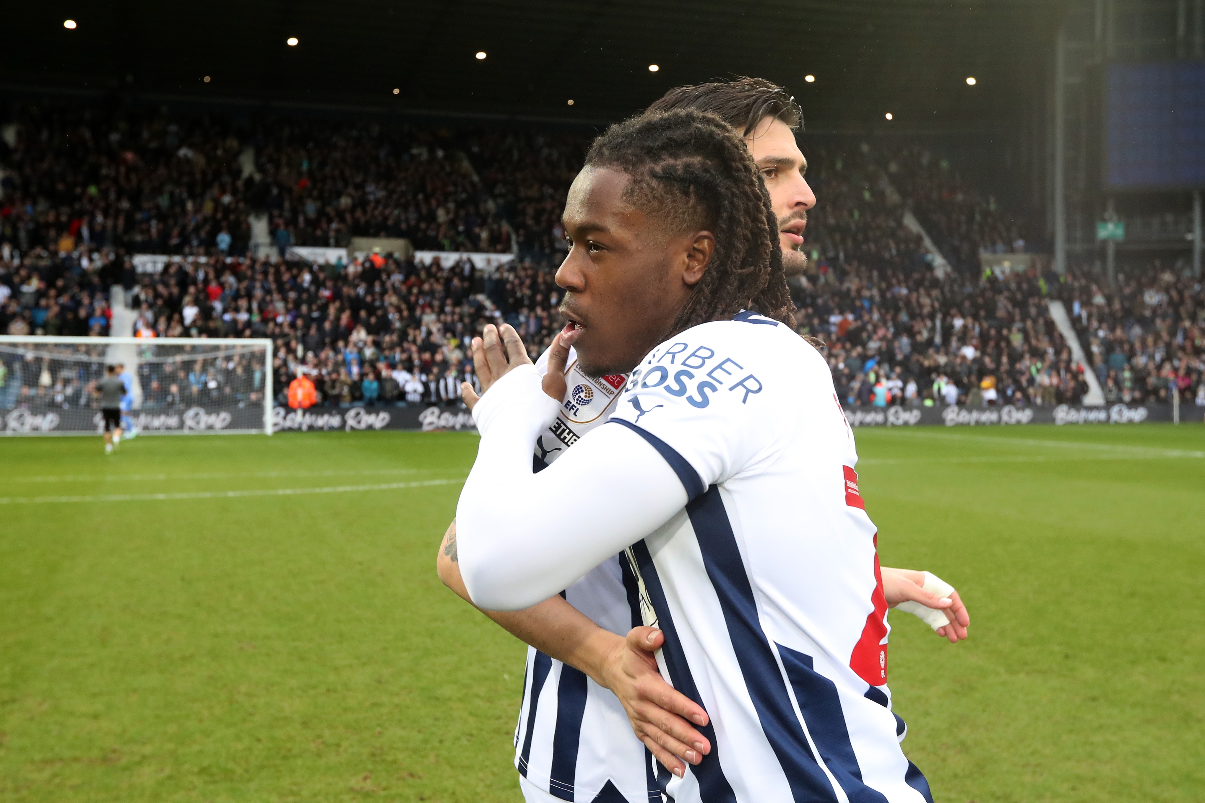 Brandon Thomas-Asante and Okay Yokuslu embrace before the game against Birmingham City