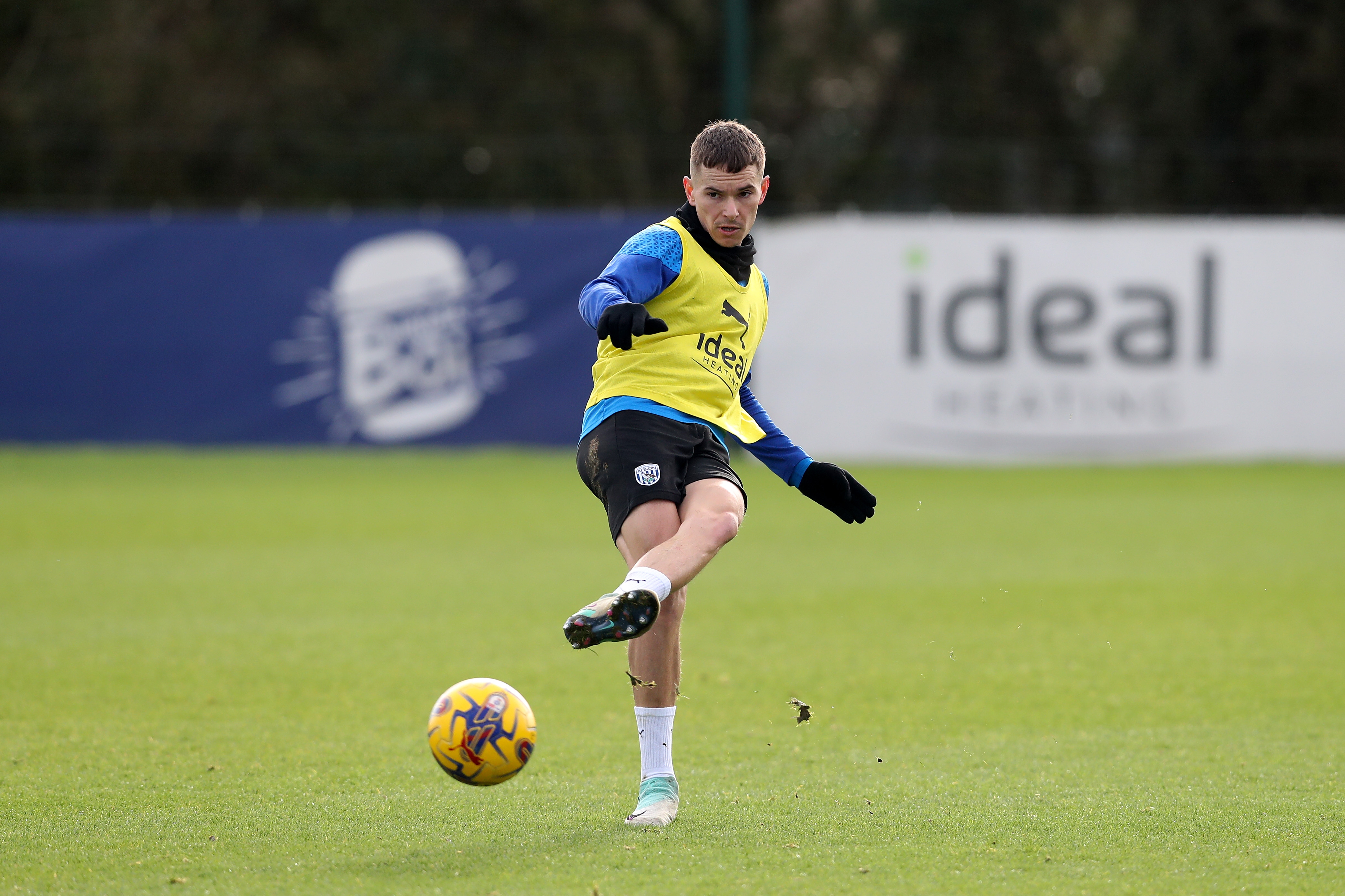 Conor Townsend passes the ball during training