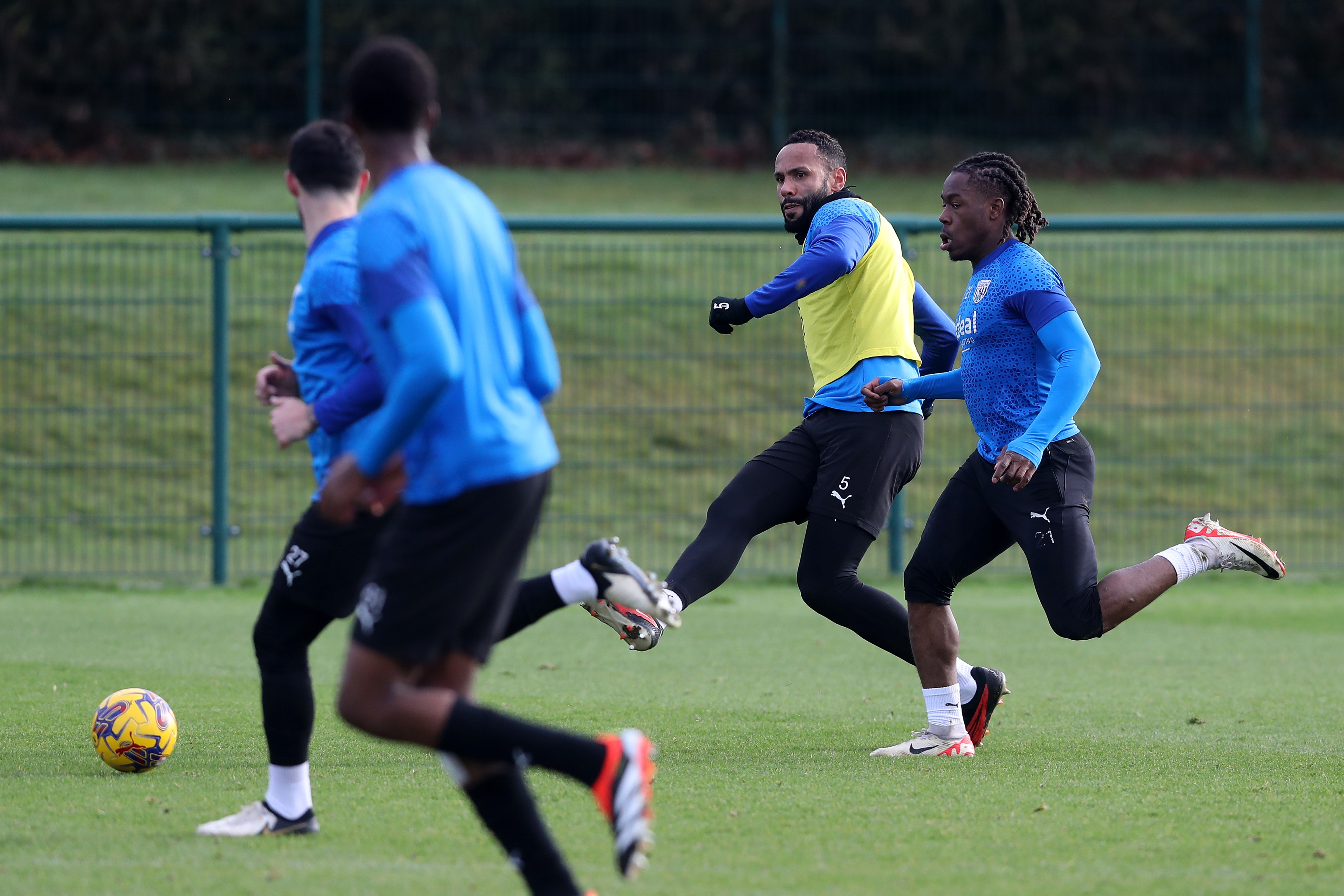 Kyle Bartley passes the ball during training