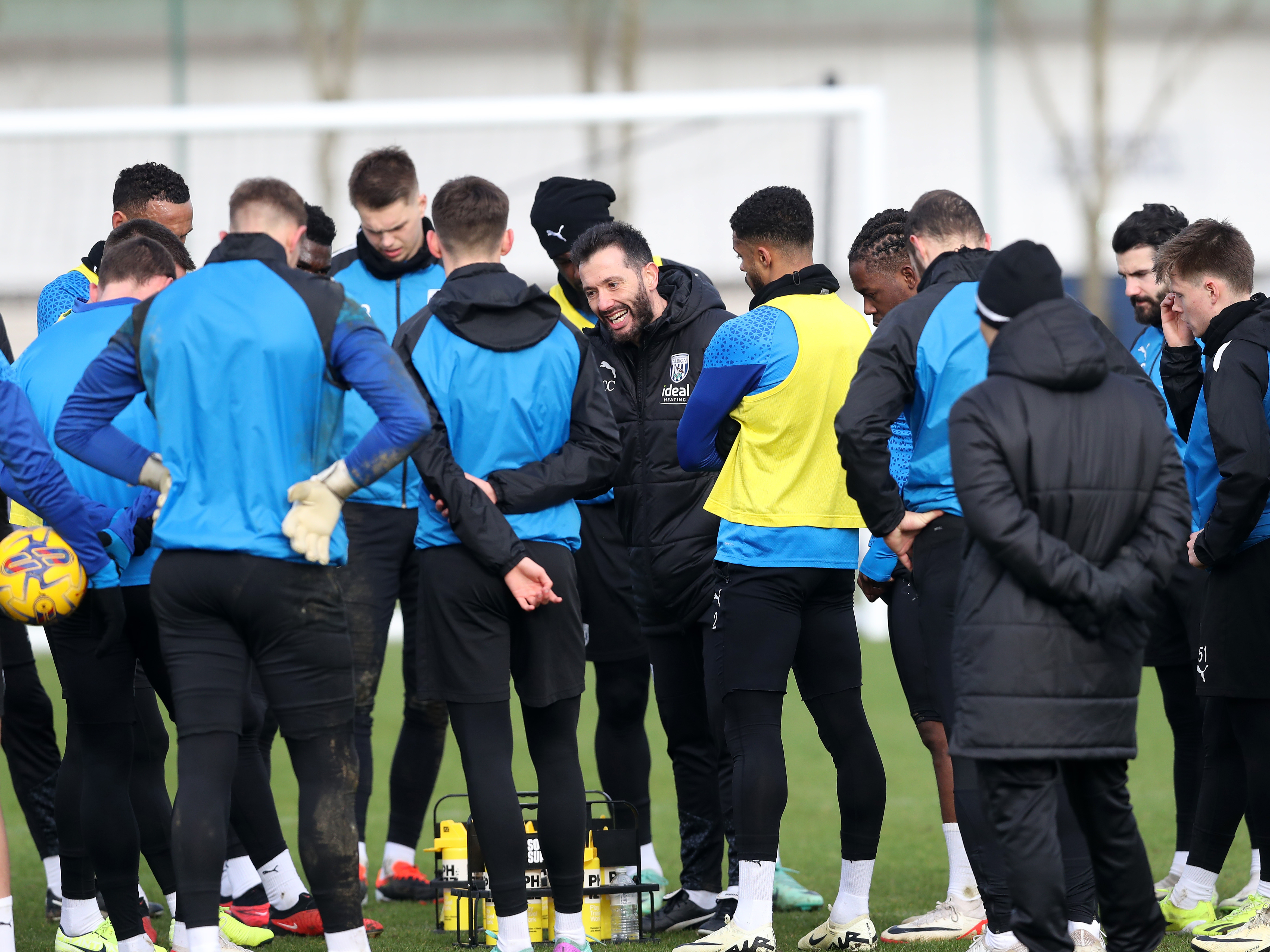 Carlos Corberan delivers info to his squad during training