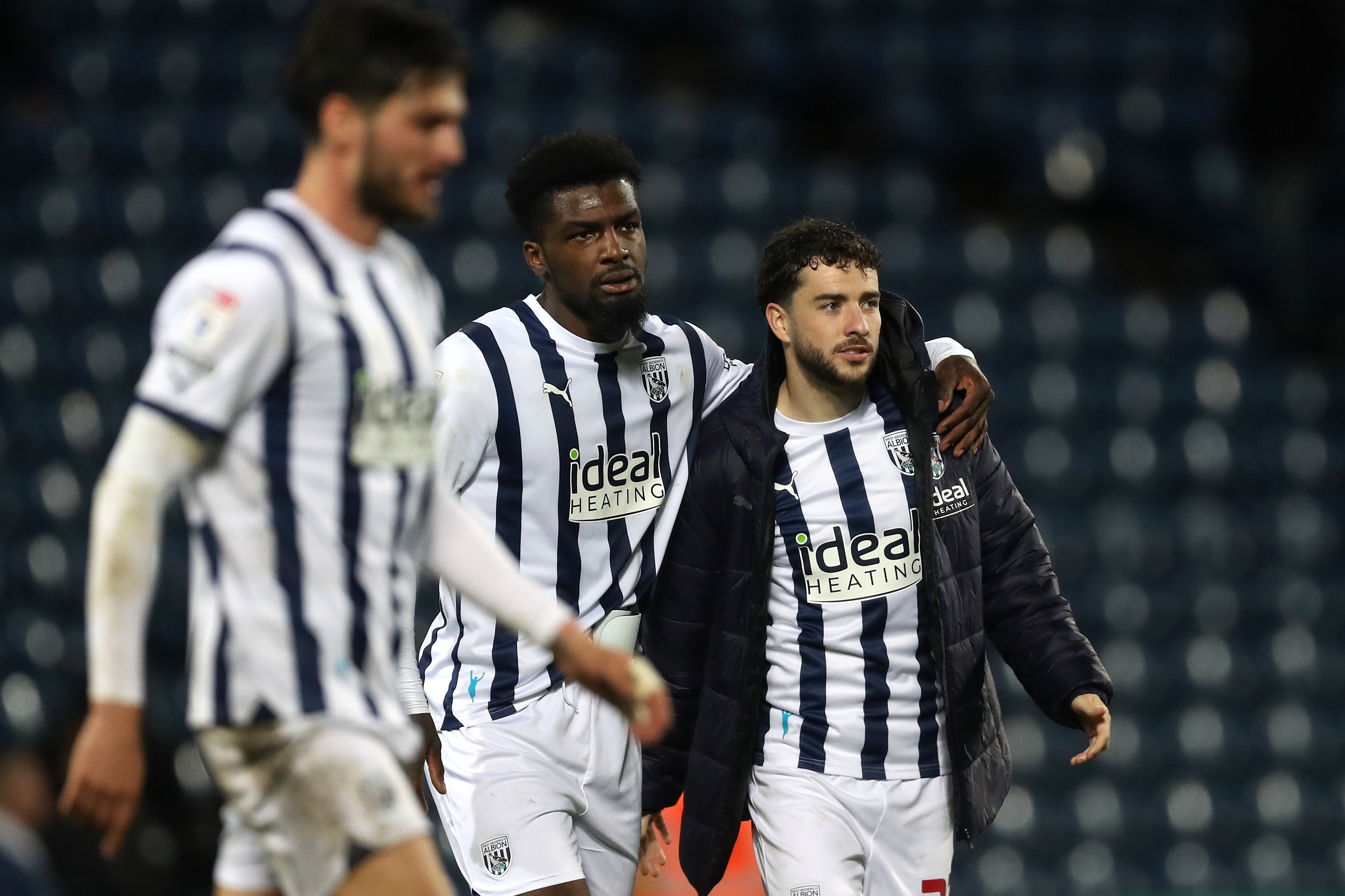 Cedric Kipre and Mikey Johnston on the pitch together after beating Cardiff